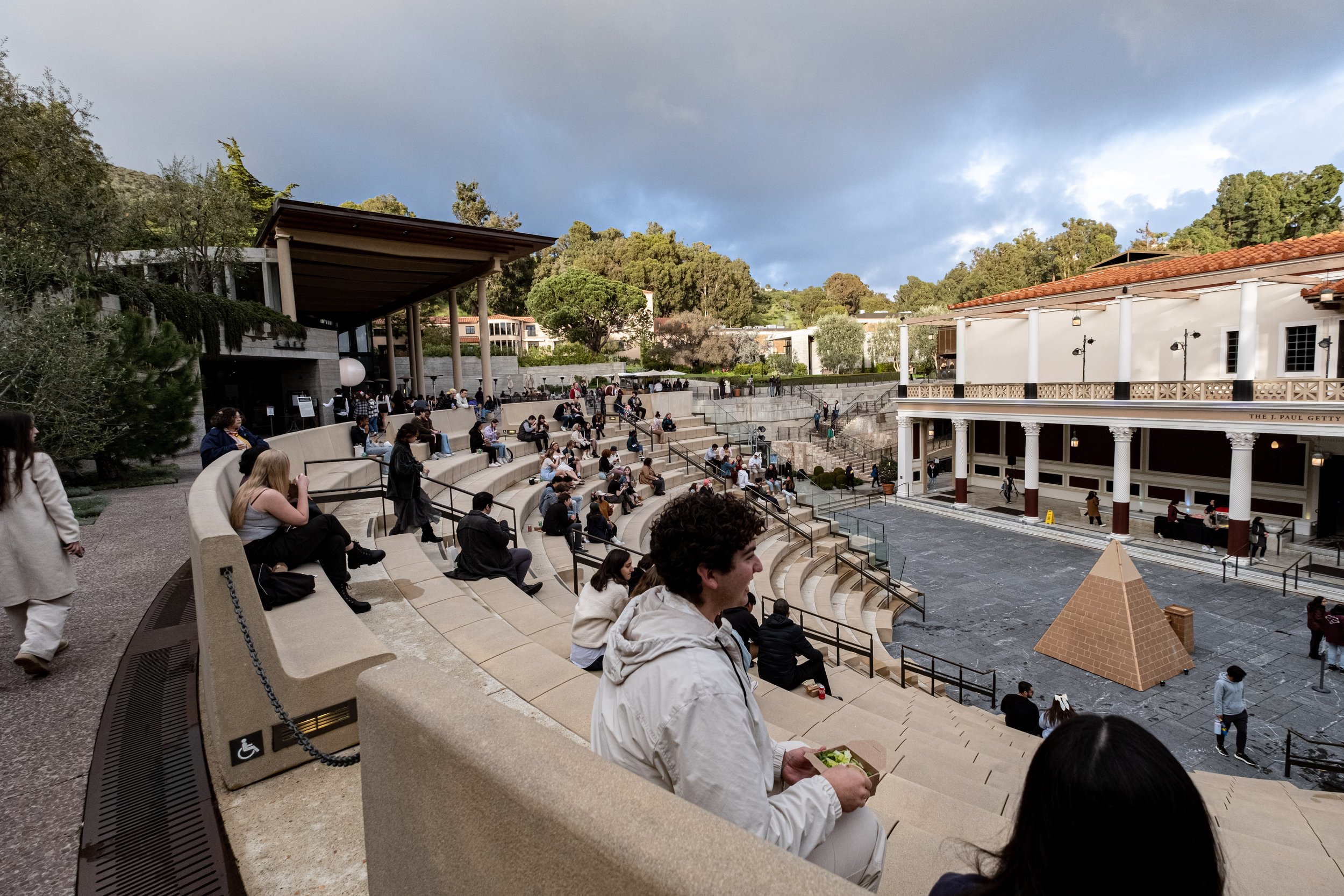  Students from various Southern California colleges sit on the steps of the Getty Villa College Night at in Pacific Palisades, Calif. on Wednesday, March 22, 2023 at College Night. (Akemi Rico | The Corsair) 