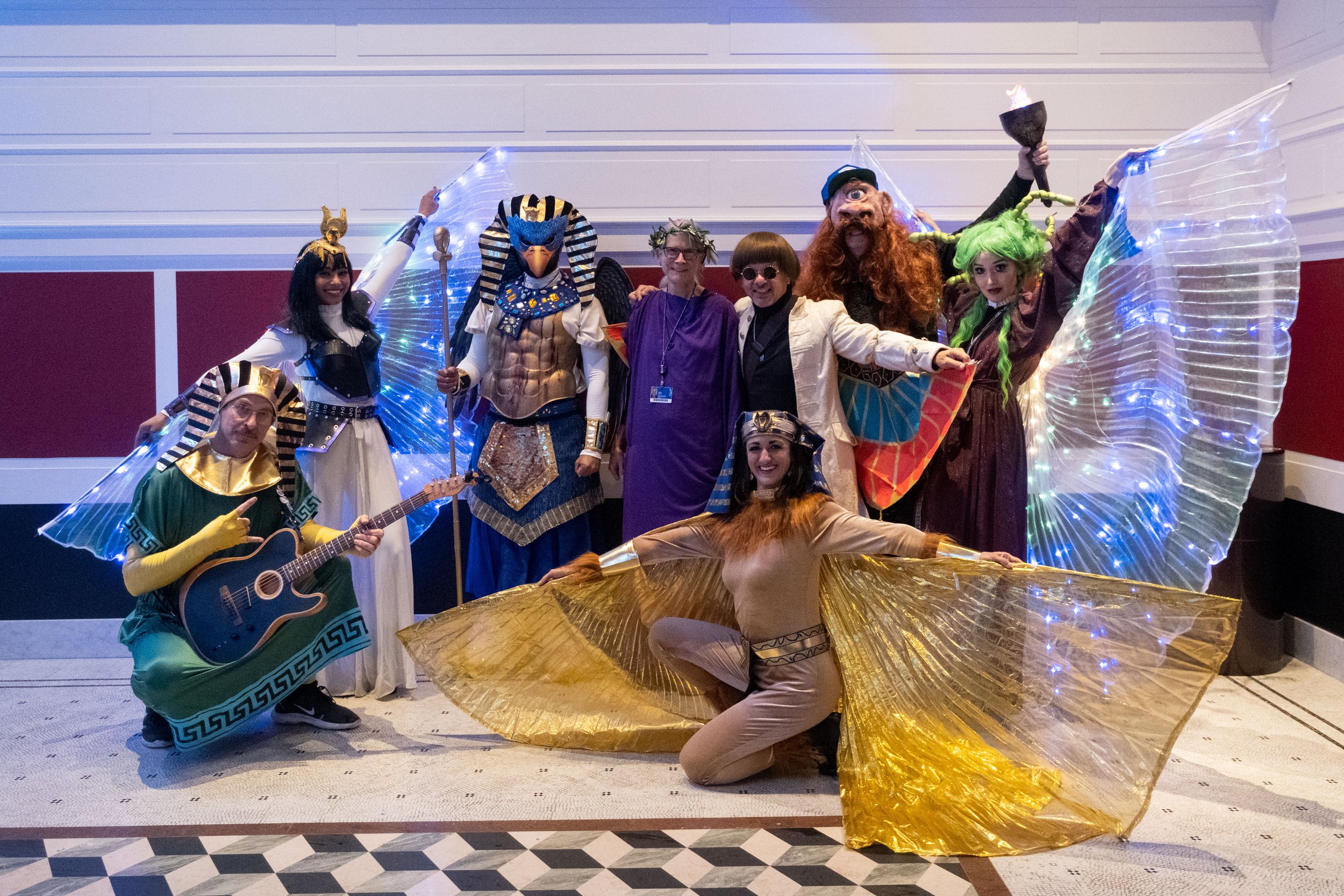  The Troubadour Theater, aka "The Troubies," pose with the organizer of the event, Dr. Shelby Brown, at the Getty Villa Museum in Pacific Palisades, Calif. on Wednesday, March 22, 2023 at College Night. From L to R: The Sphinx, the Goddess Hathor, th
