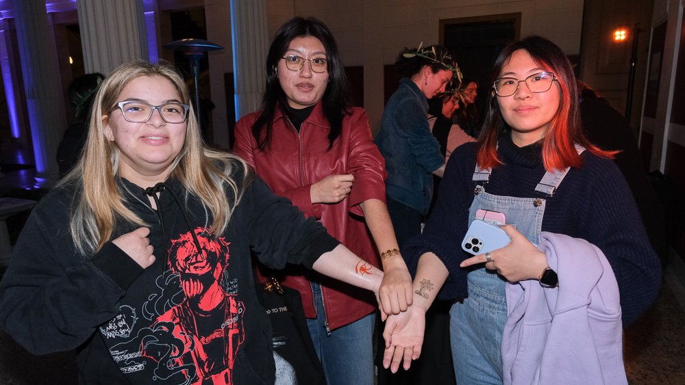  College Students Jennifer Dane(right) Maria Santiago (middle), and Madison Medhat(left) received egyptian and muthological  wash-away tattoos at the tattoo table in the Getty Villa in inner peristyle  March 22, 2023 Alejandro Contreras | The Corsair