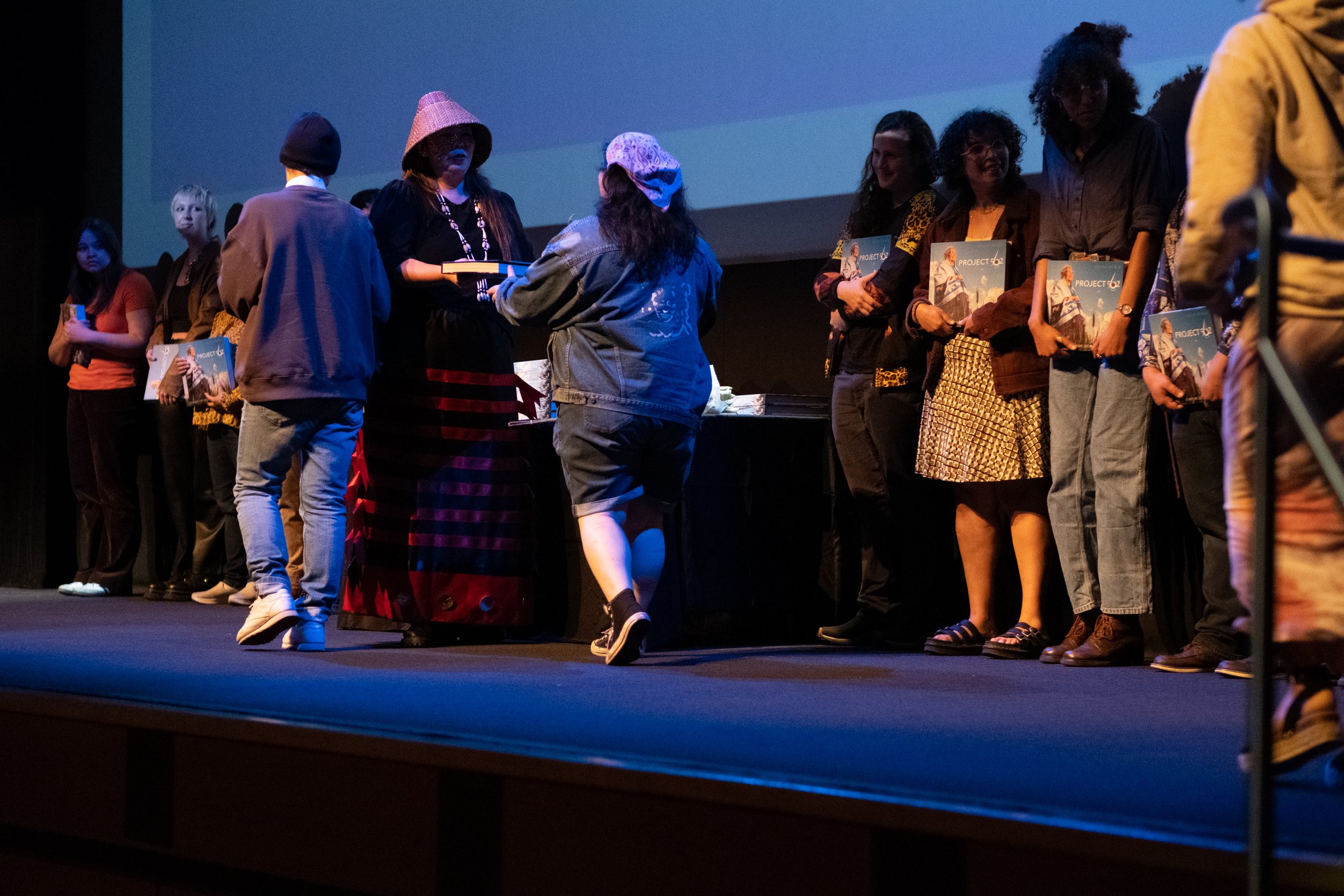 On Monday May 8th, 2023, Matika Wilbur, author of "Project 562, Changing The Way We See Native America", at the BroadStage Theater in Santa Monica, Calif., presents copies of her books as gifts to the Santa Monica College students who were instrumen