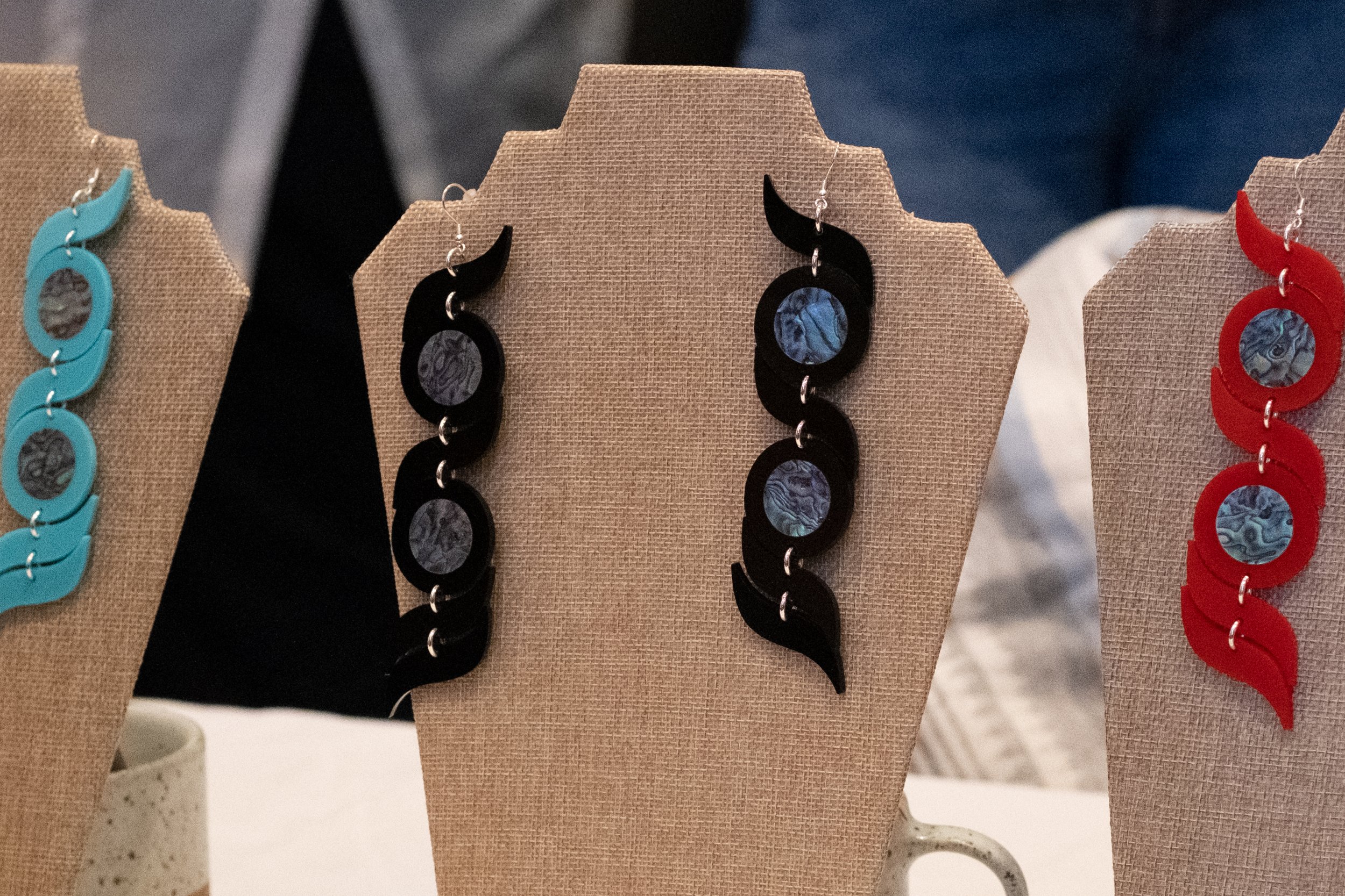  A close up of the earrings Matika and her mother wear, which are for sale outside the photo exhibit at the Barrett Art Gallery in Santa Monica, Calif. on Monday, May 8th, 2023. (Akemi RIco | The Corsair) 