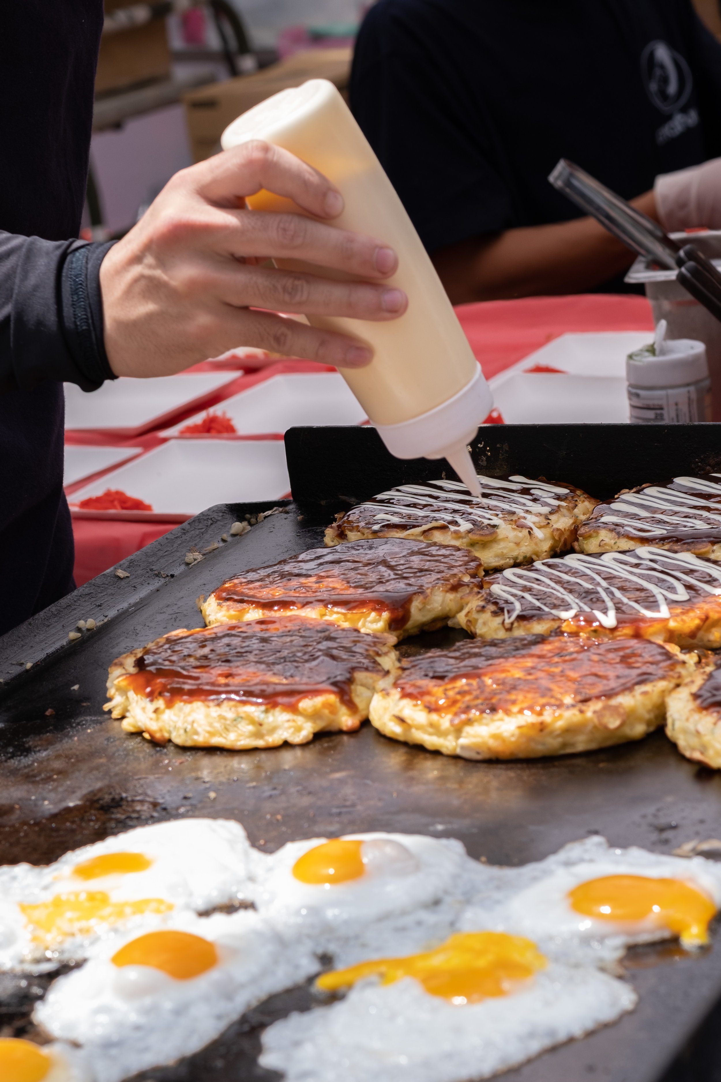  Food booths prepared many types of traditional Japanese food. Shown here is "okonomiyaki," a savory pancake, at the Torrance Cultural Arts Center in Torrance, Calif., at the Weekly LALALA 20th Anniversary event on Sunday, May 14th, 2023. (Akemi Rico