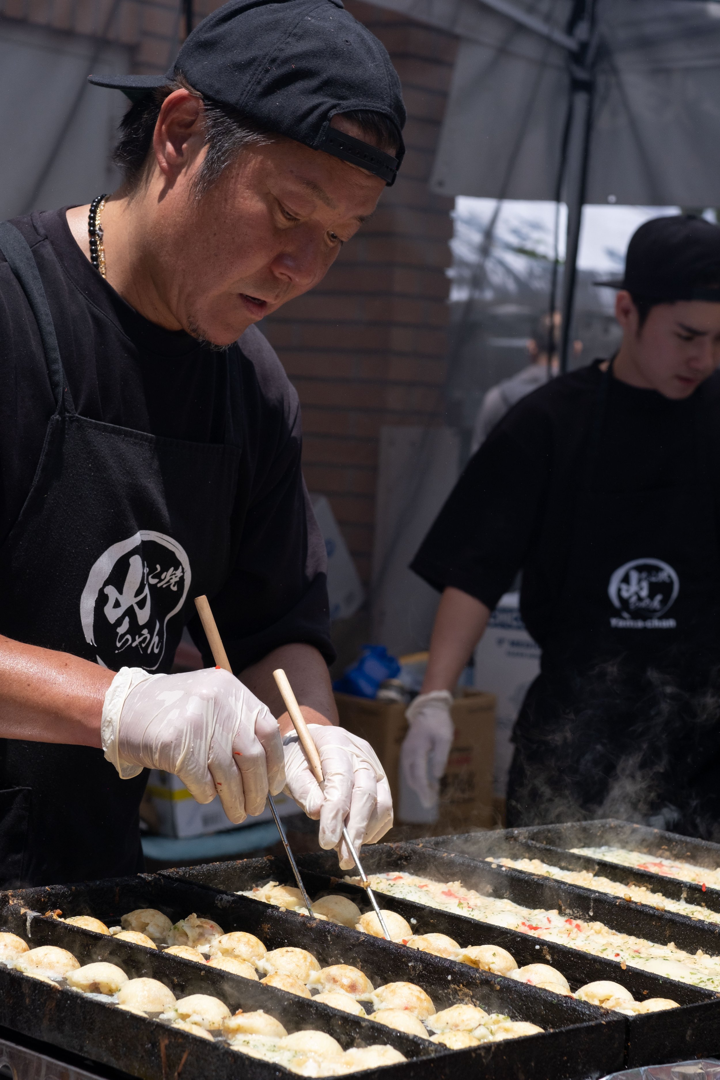  Food booths prepared many types of traditional Japanese food. Shown here is "takoyaki," octopus dumplings, at the Torrance Cultural Arts Center in Torrance, Calif., at the Weekly LALALA 20th Anniversary event on Sunday, May 14th, 2023. (Akemi Rico |