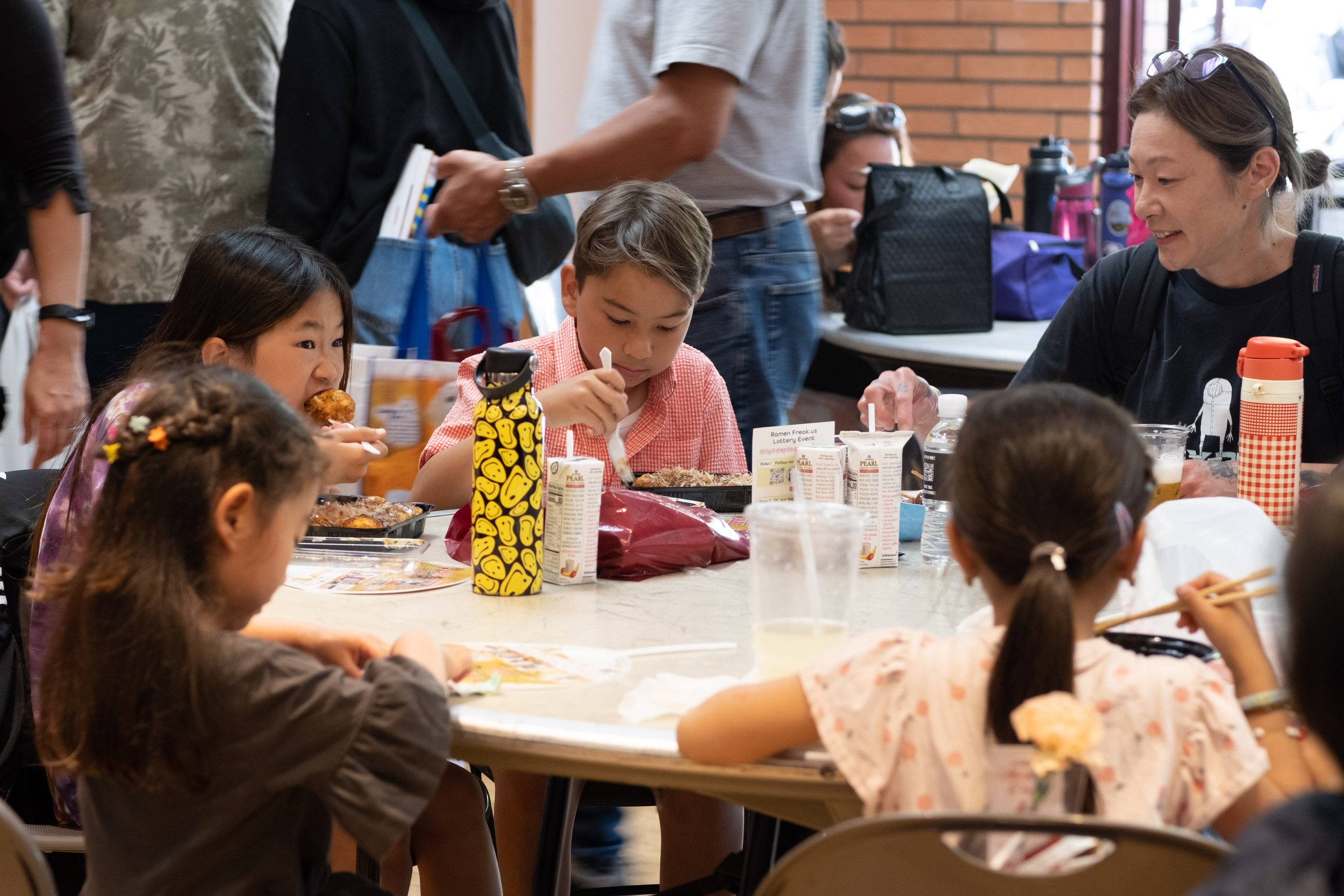  Inside the grounds at the Torrance Cultural Arts Center in Torrance, Calif., festival goers of all ages enjoy Japanese food at the Weekly LALALA 20th Anniversary event on Sunday, May 14th, 2023. (Akemi Rico | The Corsair) 