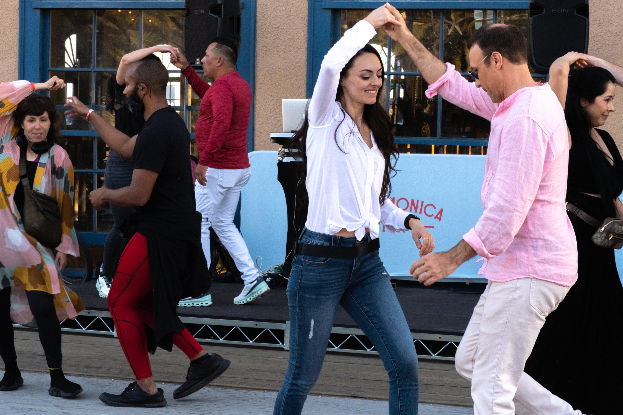  Santa Monica Pier in Santa Monica, Calif. hosts Locals' Night every third Thursday with free programming from 4:00pm to 10:00pm. Salsa lessons teach beginners basic moves on the East Merry-Go-Round deck on Thursday, April 20, 2023. (Akemi Rico | The