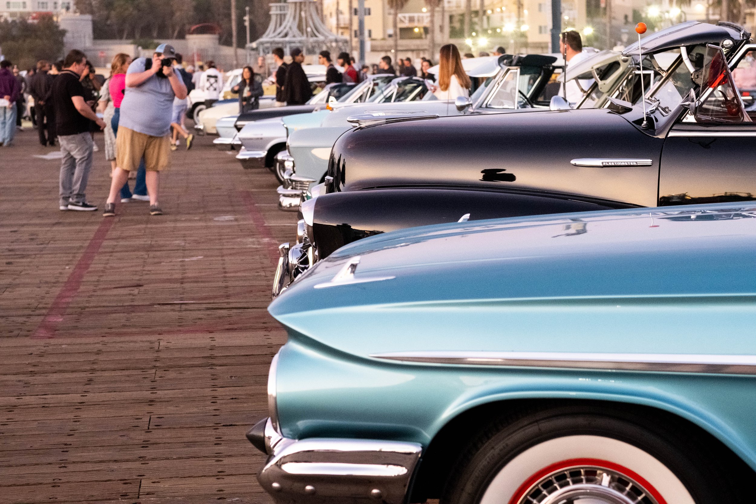  On Thursday, April 20, 2023, onlookers snap photos at the Westside Dream Car Club car show on the Santa Monica Pier parking deck in Santa Monica, Calif. The pier hosts Locals' Night every third Thursday with free programming from 4:00pm to 10:00pm. 