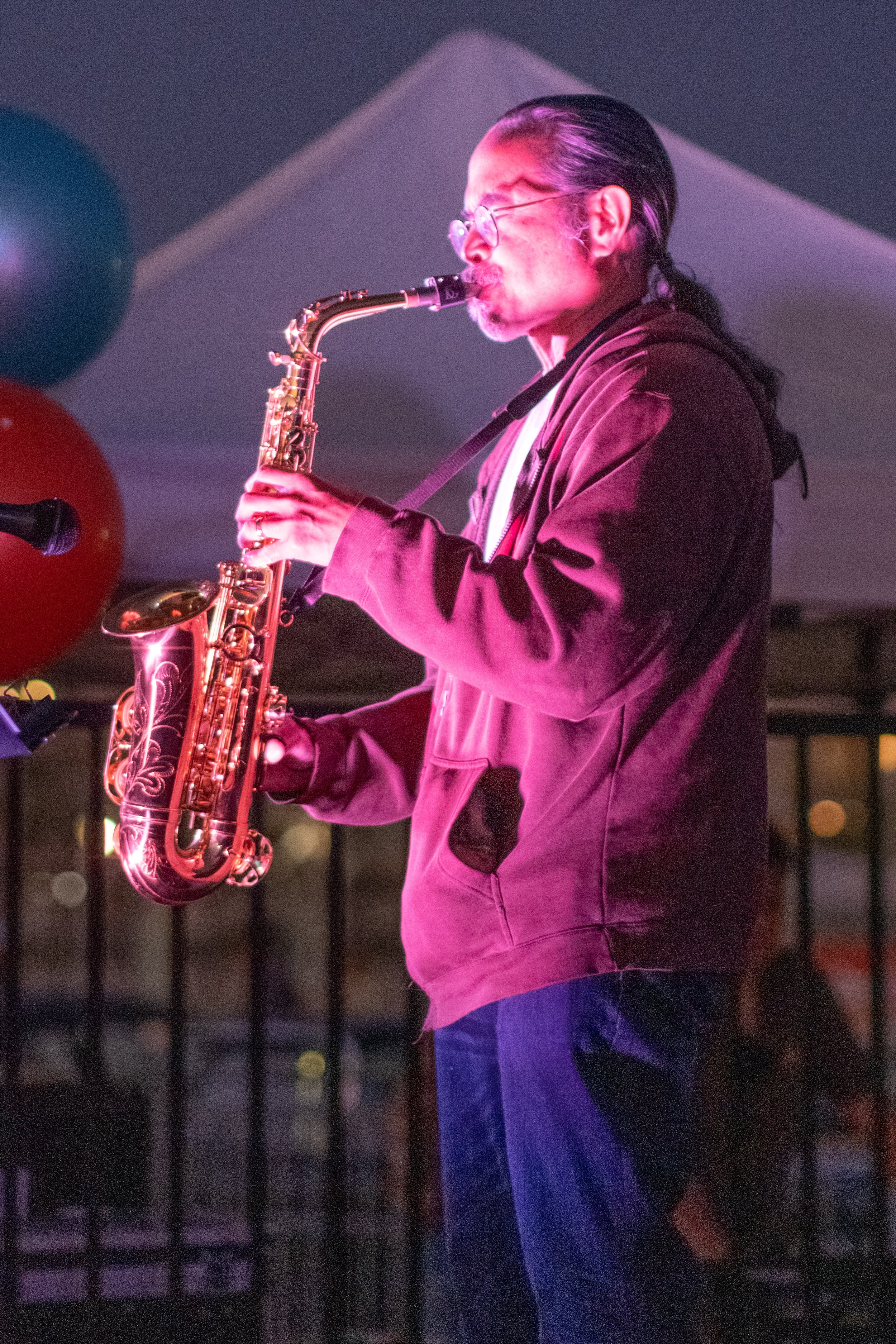  On the saxophone for the Horny Toads at Locals' Night on the Santa Monica Pier on the parking deck in Santa Monica, Calif. The pier hosts Locals' Night every third Thursday with free programming from 4:00pm to 10:00pm.  (Akemi Rico | The Corsair) 