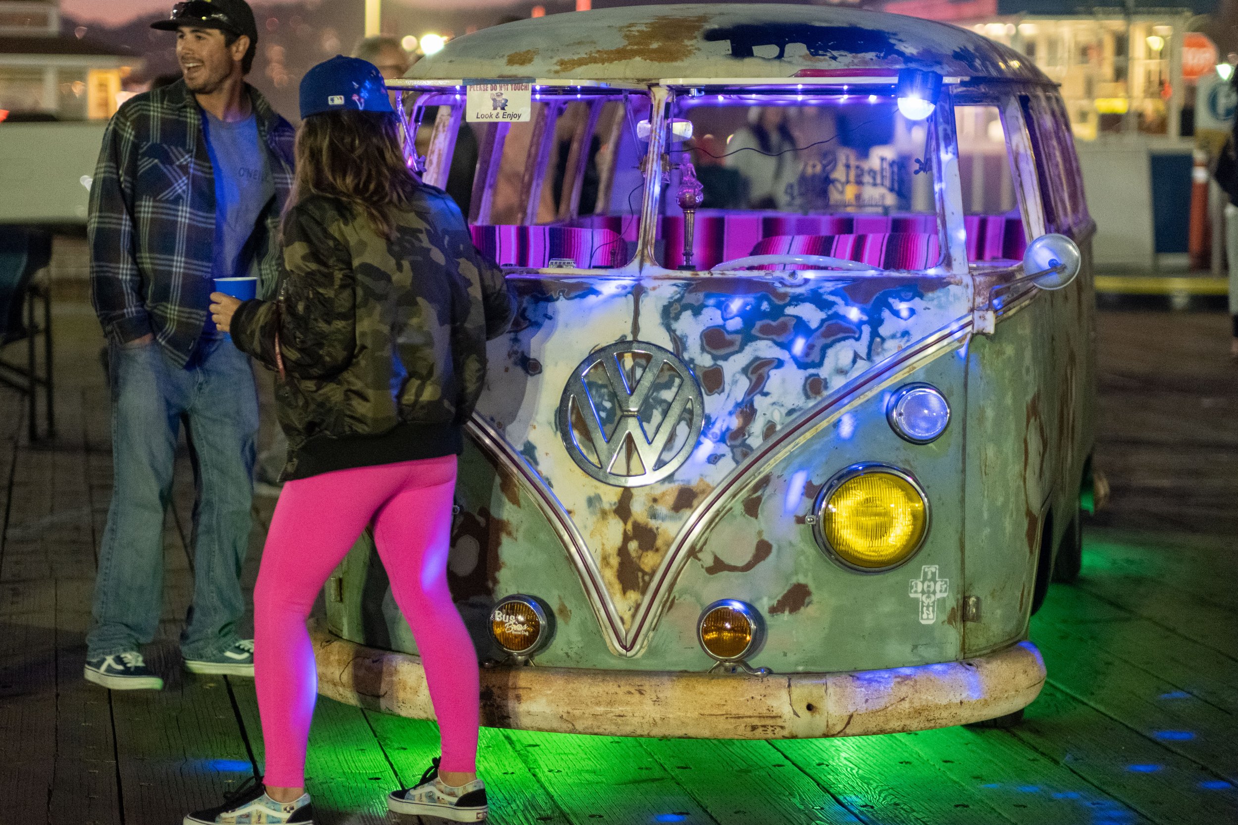  Onlookers enjoy the cars on display at Locals' Night on Thursday, April 20, 2023 on the Santa Monica Pier at the Westside Dream Car Club on the parking deck in Santa Monica, Calif. The pier hosts Locals' Night every third Thursday with free programm