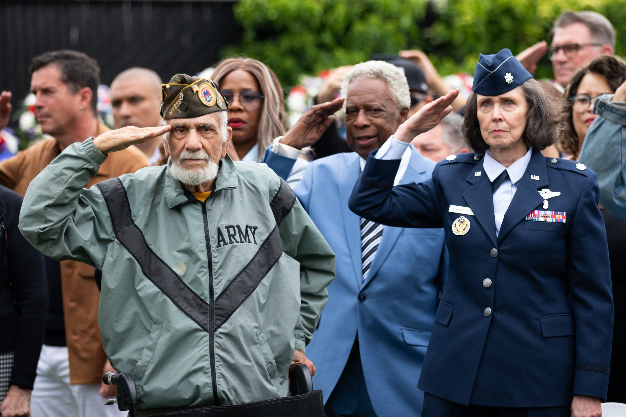 People salute or hold their hand over their heart during the United States National Anthem during the Memorial Day Celebration at Los Angeles National Cemetery, in Los Angeles, Calif., on Monday, May 29, 2023. Only those who have served in the milit