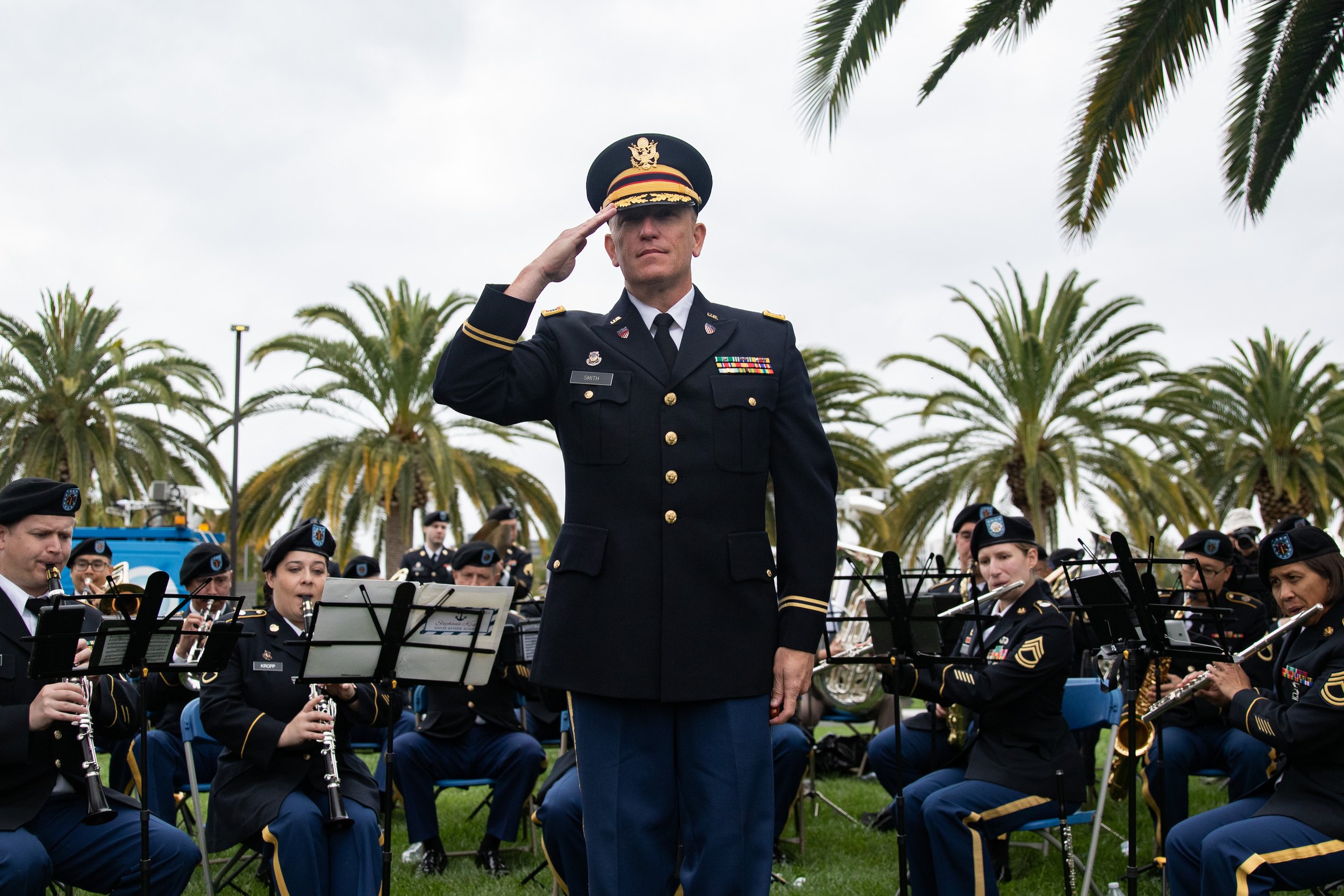  Chief Warrant Officer Jeff Smith saluting to the different military branches during the “Branches of Service Medley” played by the 300th  Army Band during the Memorial Day Celebration at Los Angeles National Cemetery in Los Angeles, Calif., on Monda
