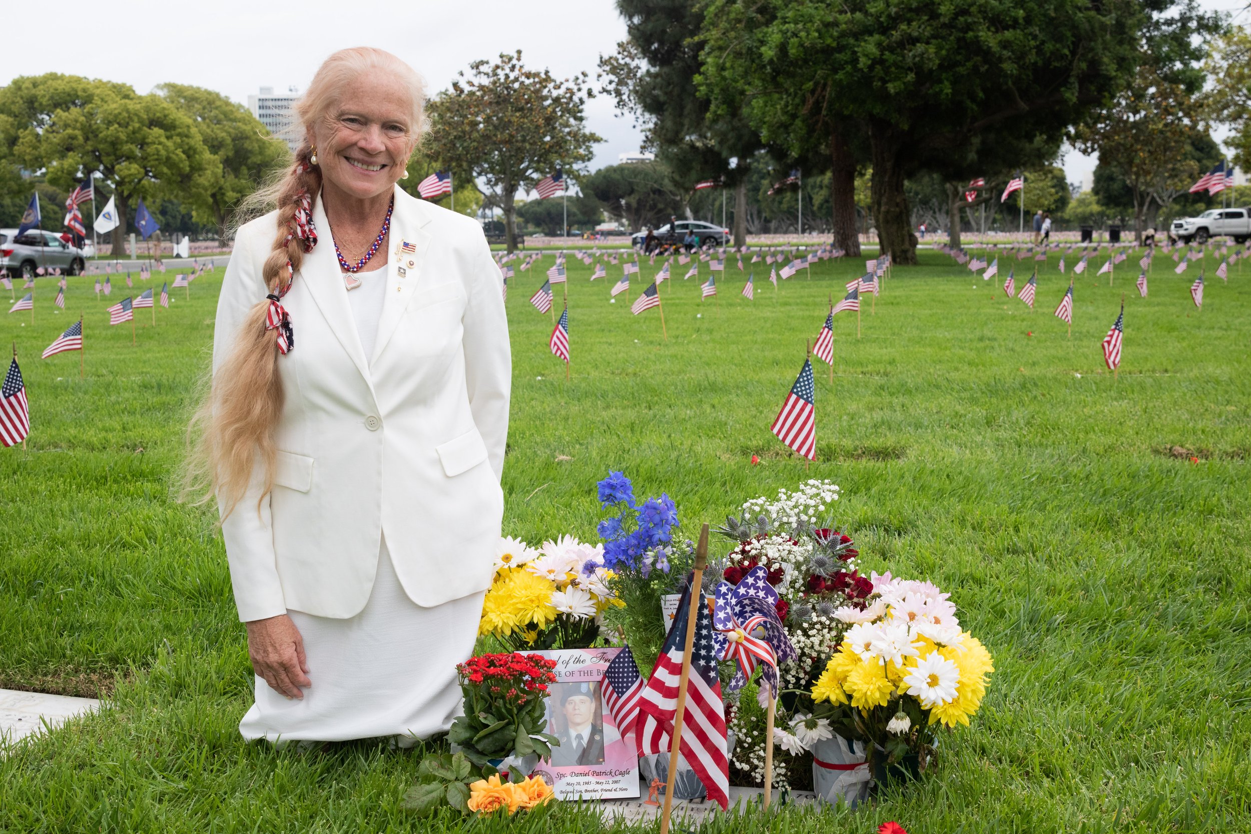  Gail Johnson next to her son Daniel Patrick Cagle grave on Memorial Day at Los Angeles National Cemetery in Los Angeles, Calif., on Monday, May 29, 2023. Cagle was killed in action on May 23, 2007, during Operation Iraqi Freedom when an improvised e