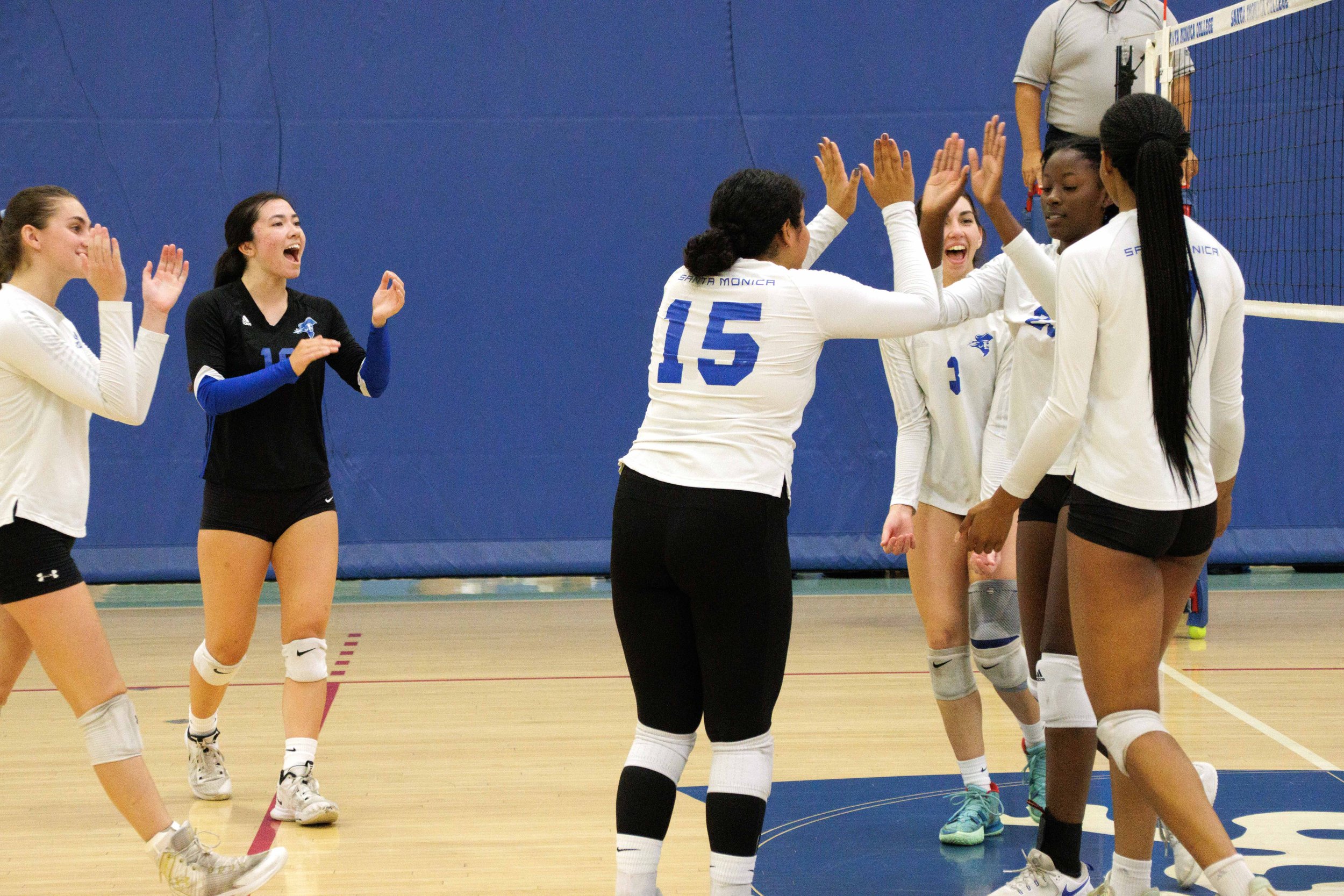  The Santa Monica College (SMC) Women's Volleyball team celebrates as they won a point, bringing their score to 18-14, during a match against San Diego Miramar at the SMC gymnasium, Santa Monica, Calif. Sept. 08, 2023. 