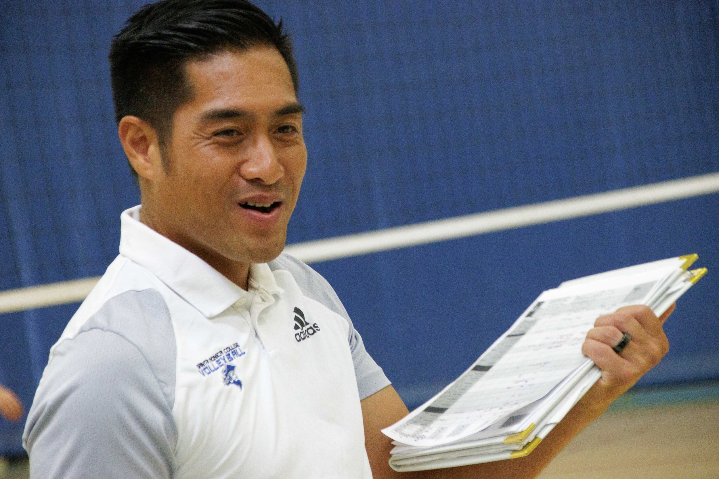  Coach Christian Cammayo of Santa Monica College Women's Volleyball smiles as his team wins another point against San Diego Miramar, bringing the score to 23-16 at the SMC gymnasium, Santa Monica, Calif. on Sept. 08, 2023. (Danniel Sumarkho | The Cor