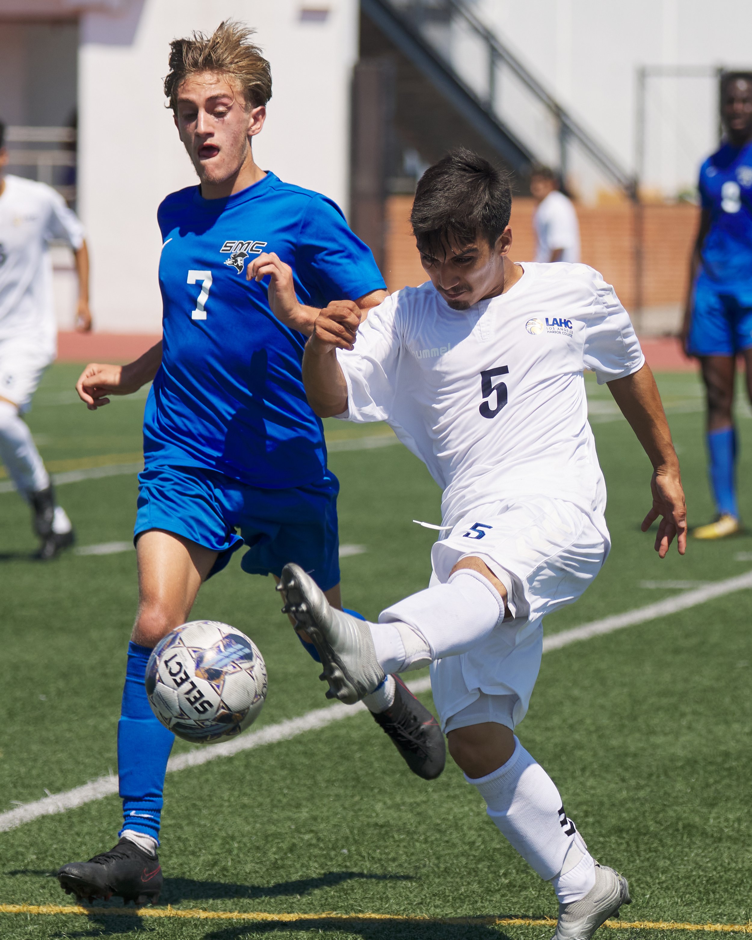  Los Angeles Harbor College Seahawks' Tommy Murillo (right) kicks the ball away from Santa Monica College Corsairs' Darren Lewis (left) during the men's soccer match on Friday, Sept. 9, 2023, at Corsair Field in Santa Monica, Calif. The Corsairs won 