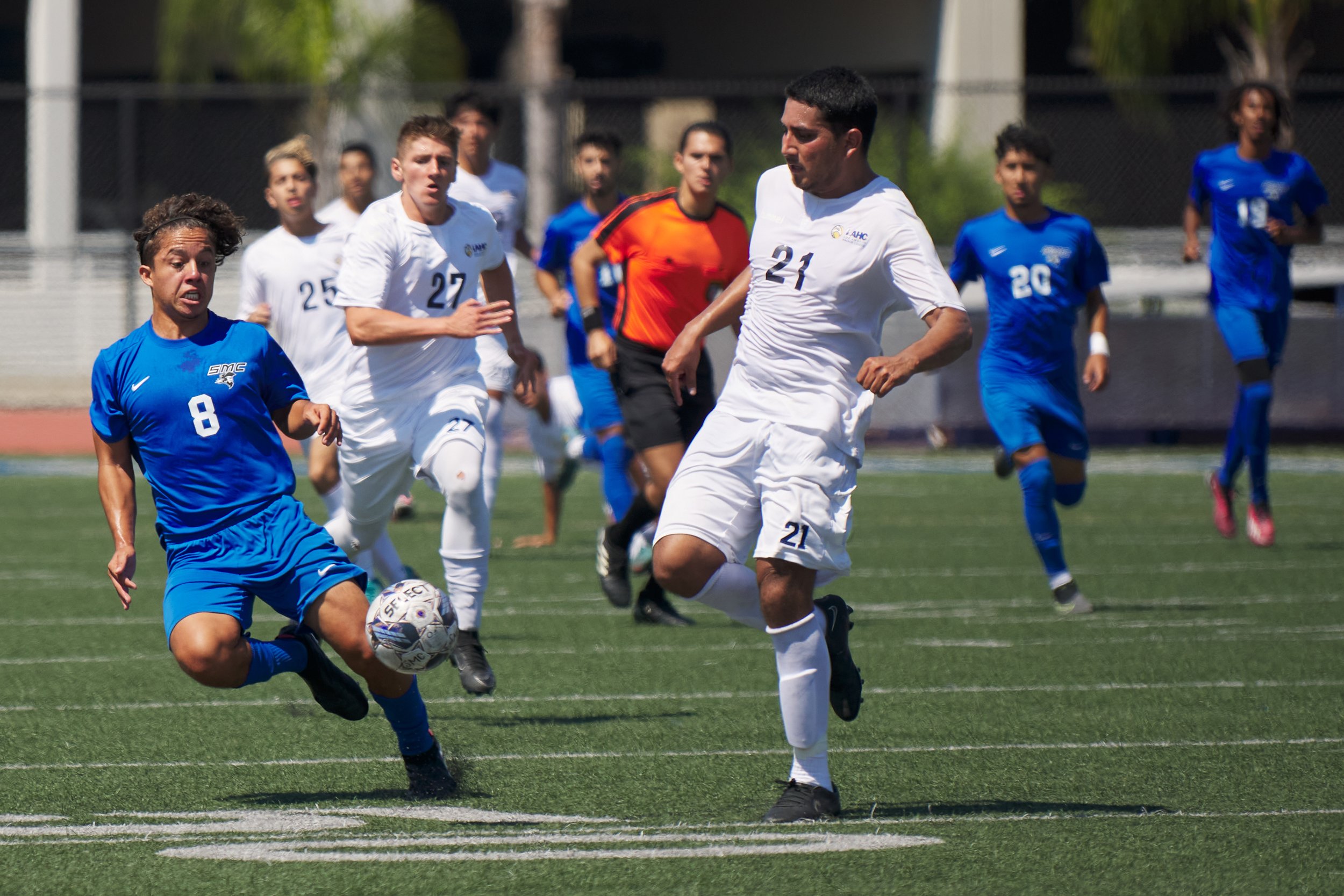  Los Angeles Harbor College Seahawks' Jesus Torres (21) winds up to kick the ball away from Santa Monica College Corsairs' Michael Chavarri (8) during the men's soccer match on Friday, Sept. 9, 2023, at Corsair Field in Santa Monica, Calif. The Corsa