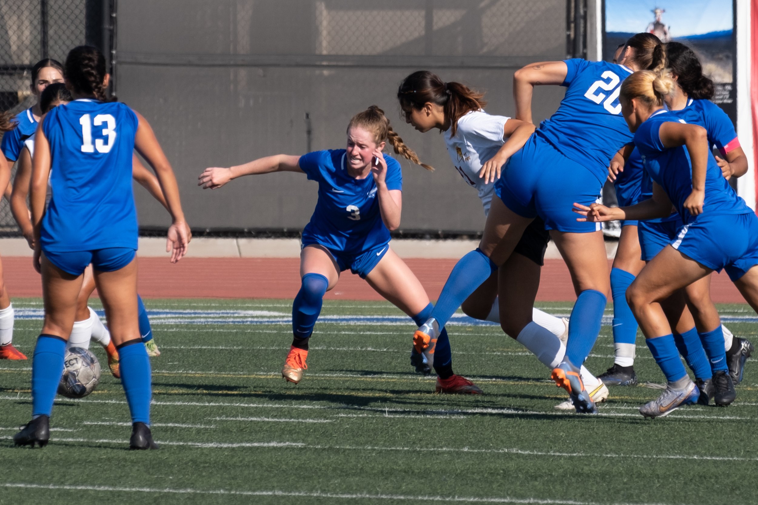  The Santa Monica College women's soccer team fighting hard as freshman defender Izzy Turner goes after the ball in the fourth game of the season, played against Pasadena City College at the Corsair Field in Santa Monica, Calif. on Friday, Sept. 6th,