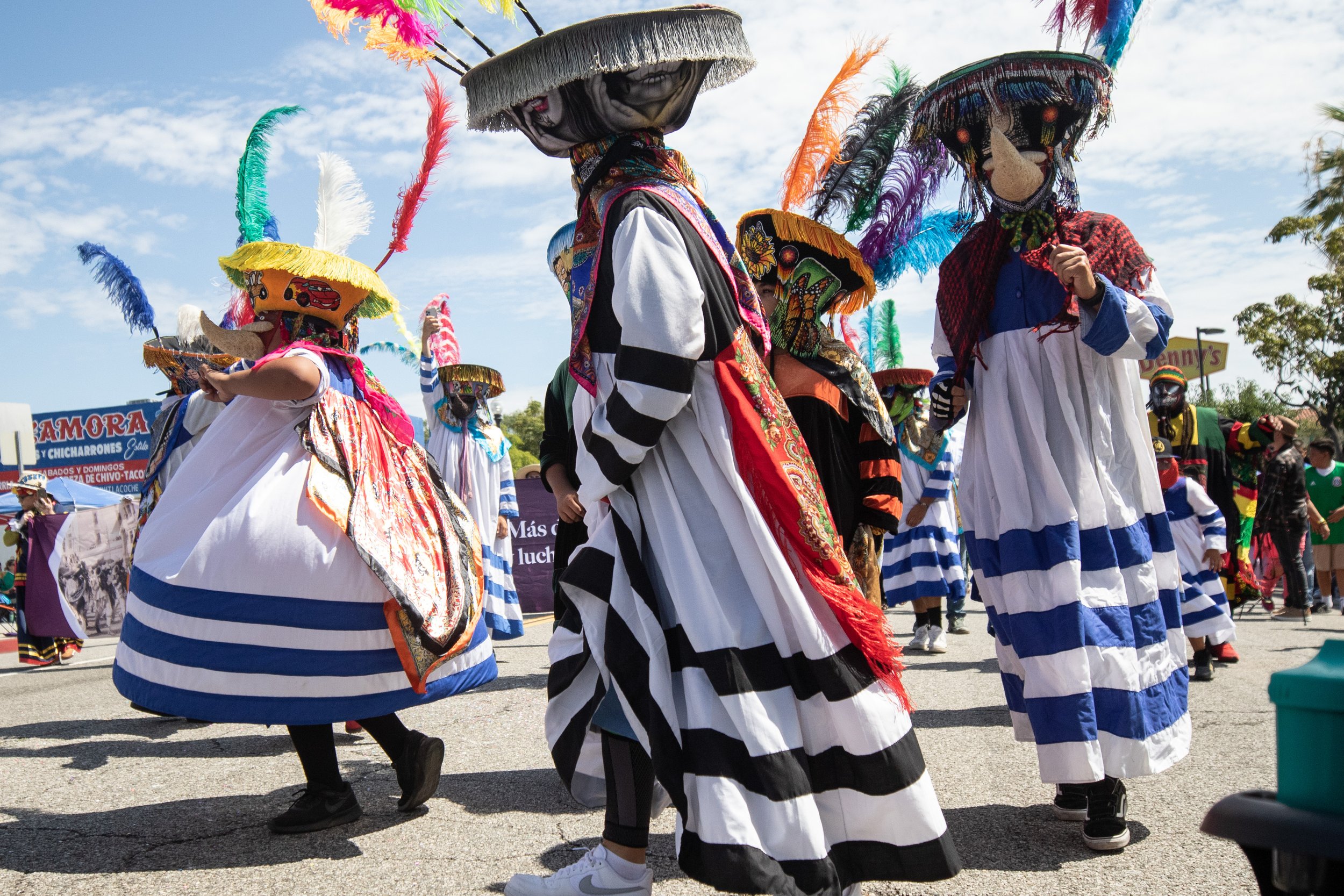  Chinelos are a kind of traditional costumed dancer which is popular in the Mexican state of Morelos. It developed as the result of a blending of indigenous and Catholic traditions, the masks being a mockery of European customs. They are shown here a