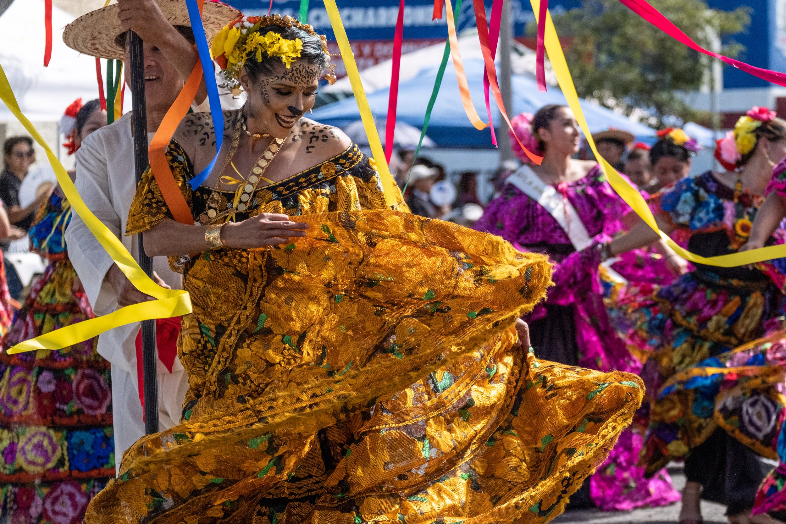  A dancer from the Chiapas contingent wearing a traditional dress with her face painted as a jaguar, a threatened species endemic to the Chiapas region. (Akemi Rico | The Corsair) 