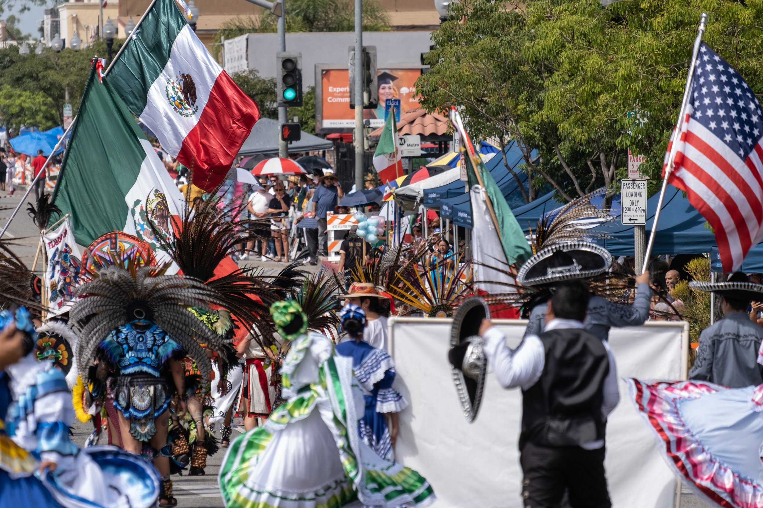  The Mexican and United States flags flying high over participants in the Mexican Independence Day Parade in East Los Angeles on Sunday, Sept. 10th, 2023. (Akemi RIco | The Corsair) 