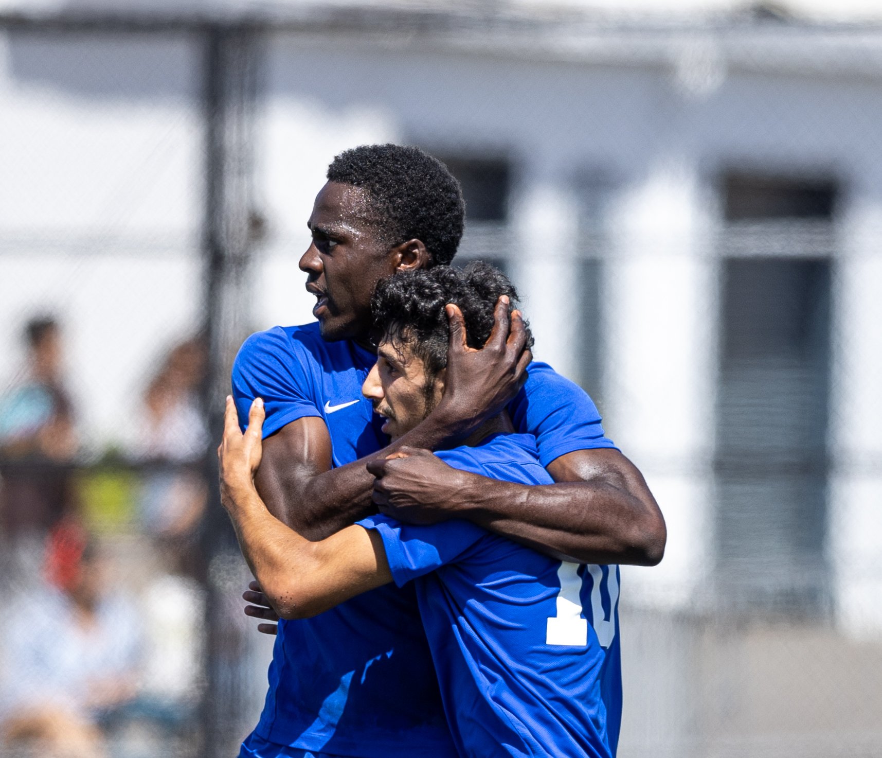  Santa Monica College men's soccer forward Philip Hephzibah(L) and midfielder Roey Kivity(R) hugging after Kivity scores a goal during their match against Norco College on Tue. Sept. 12 on Corsair Field at Santa Monica, Calif. (Danilo Perez | The Cor