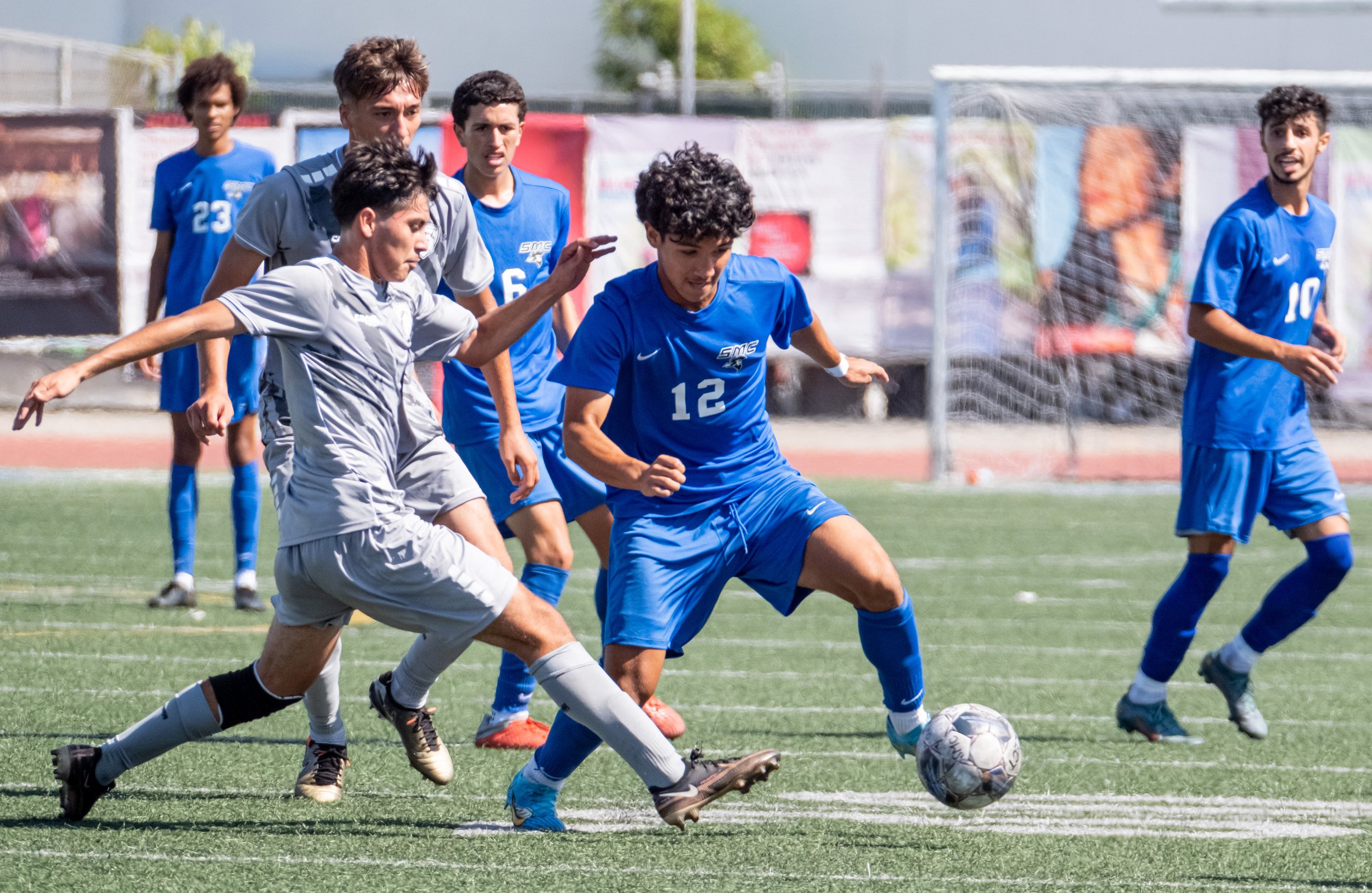  Santa Monica College men's soccer forward Jason Moreno(12)keeping the ball way from Norco College player during their match on Tue. Sept. 12 on Corsair Field at Santa Monica, Calif. (Danilo Perez | The Corsair) 