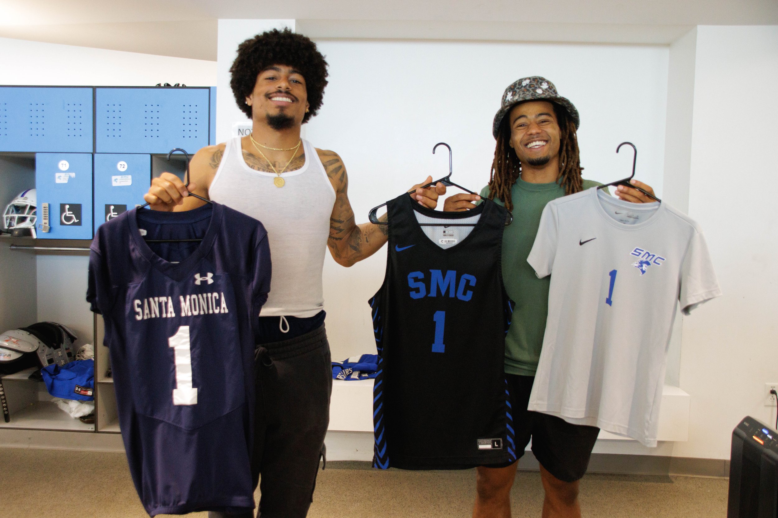  Santa Monica College (SMC) Football players number 1 Maurice Herrera, left, and number 2 Melvin Hicks, right, holding the new jerseys in the men's locker room in the SMC Core Perfomance Center, Santa Monica, Calif. Sept. 07, 2023. (Danniel Sumarkho 
