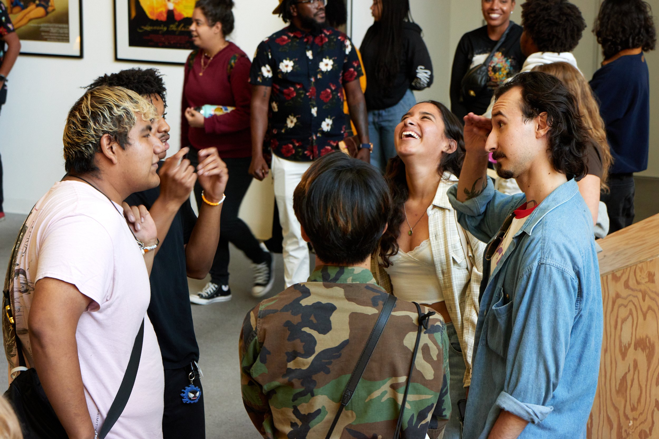  A group converses among themselves in the lobby of Santa Monica College Center for Media and Design, Santa Monica, Calif. on Sept. 15, 2023. They are waiting for the screening of the feature film "It Lives Inside" to start. (Danniel Sumarkho | The C