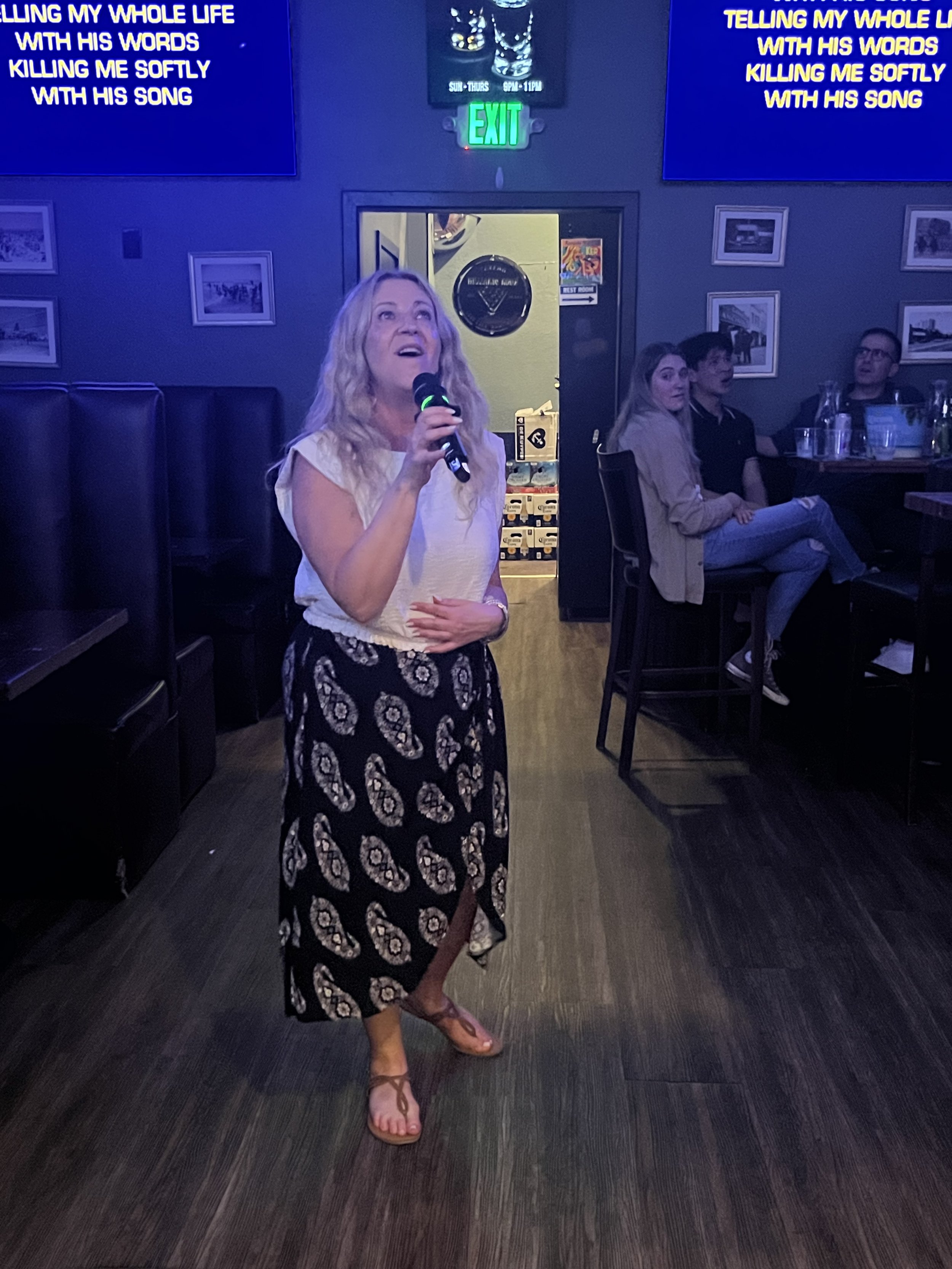  Tina Whales sings "Killing Me Softly With His Song" by Fugees during Karaoke Night Party at Tavern on Main in Santa Monica, Calif., on Wednesday, Sept. 13, 2023. Tavern on Main hosts this event twice a week every Monday and Wednesday. (Maria Lebedev