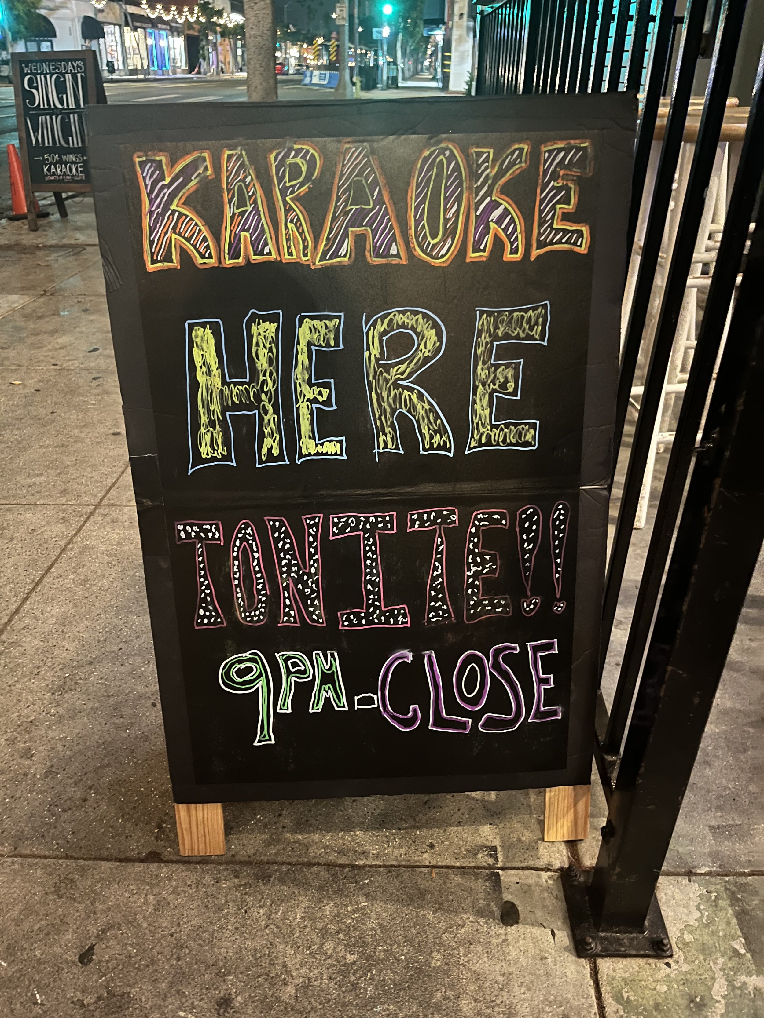  A colorful sign announcing Karaoke Night Party at Tavern on Main set up at the bar's entrance in Santa Monica, Calif., on Wednesday, Sept. 13, 2023. Tavern on Main hosts this event twice a week every Monday and Wednesday. (Maria Lebedev | The Corsai