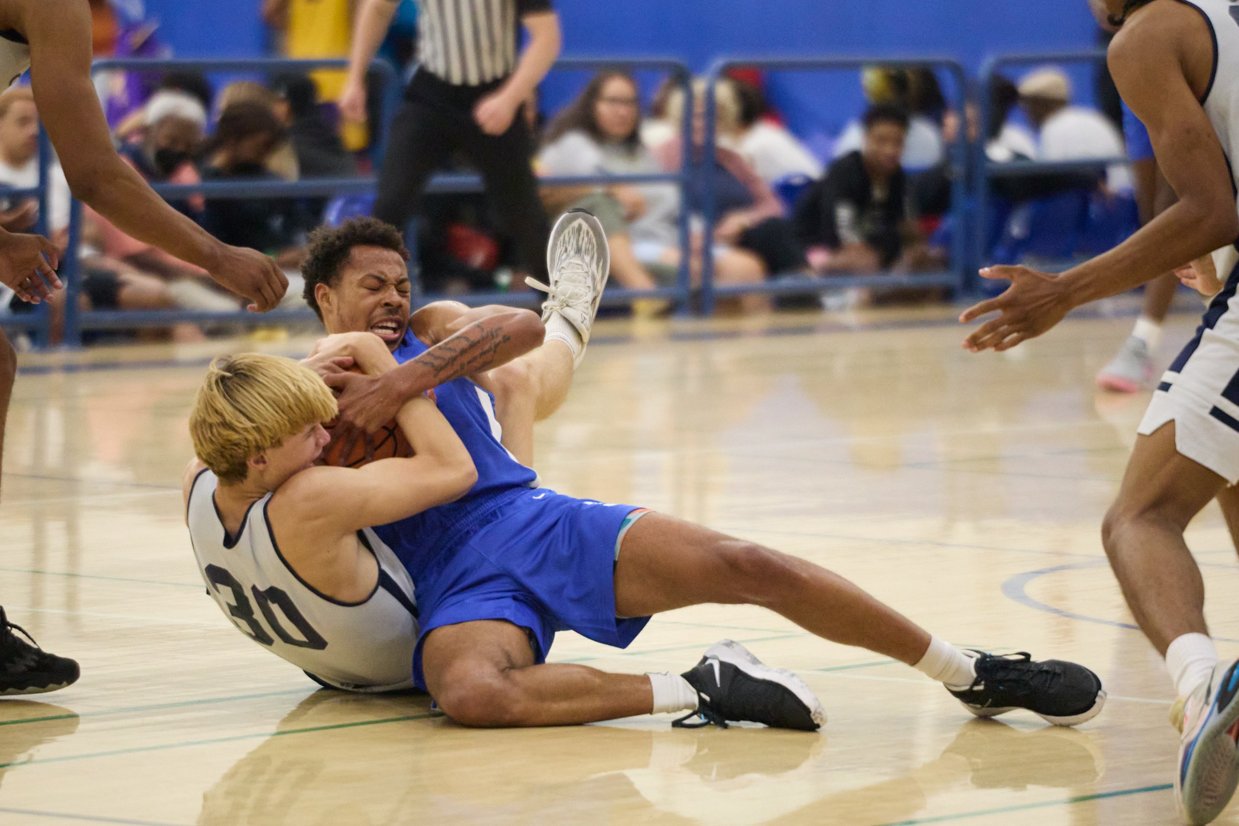  Santa Monica College Corsairs' Raymond Watts (top) and Orange Coast College Pirates' Zach Jones (bottom) fight over the ball during the SoCal Fall Juco Jamboree on Sundy, Spet 17, 2023, at Cerritos College in Norwalk, Calif. The Corsairs lost 70-76.