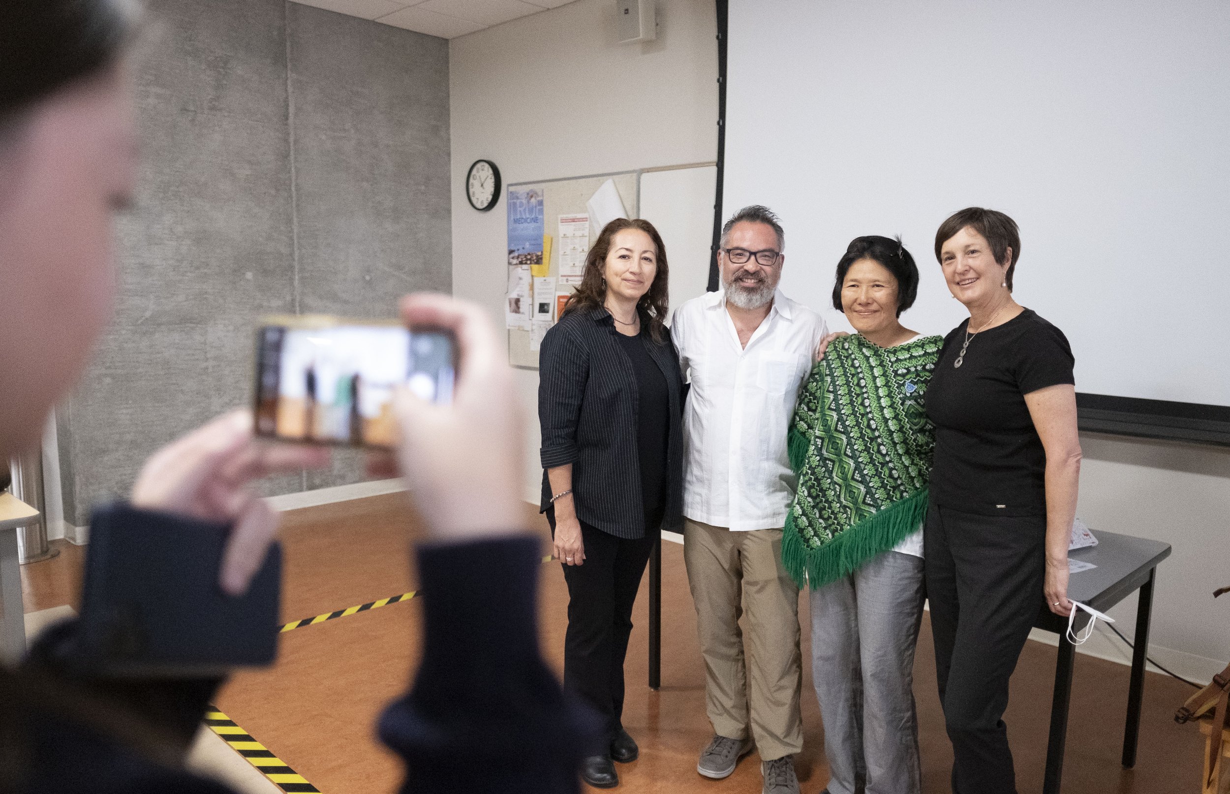 An audience member (unknown) takes a picture of director Ann Ann Kaneko (right) and Alejandro Lee, Ph.D., MLIS, introducing Kaneko’s “Manzanar, Diverted: When Water Becomes Dust” in the Humanities & Social Science building at Santa Monica College. T