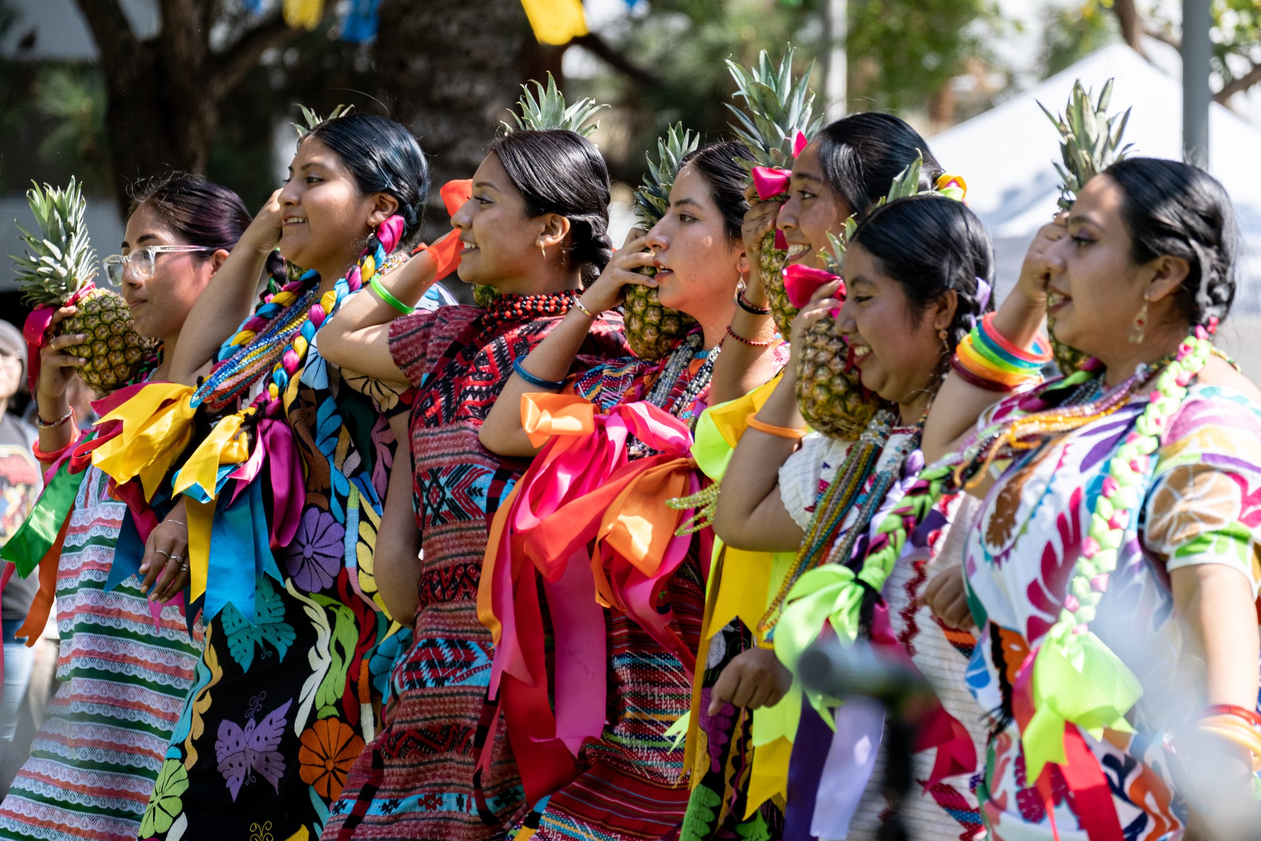  A group of seven women holding pineapples on their shoulder perform a Oaxacan dance during the Guelaguetza event at the Santa Monica College Main Campus on Thursday, Sept. 28th in Santa Monica, Calif. (Akemi Rico | The Corsair) 