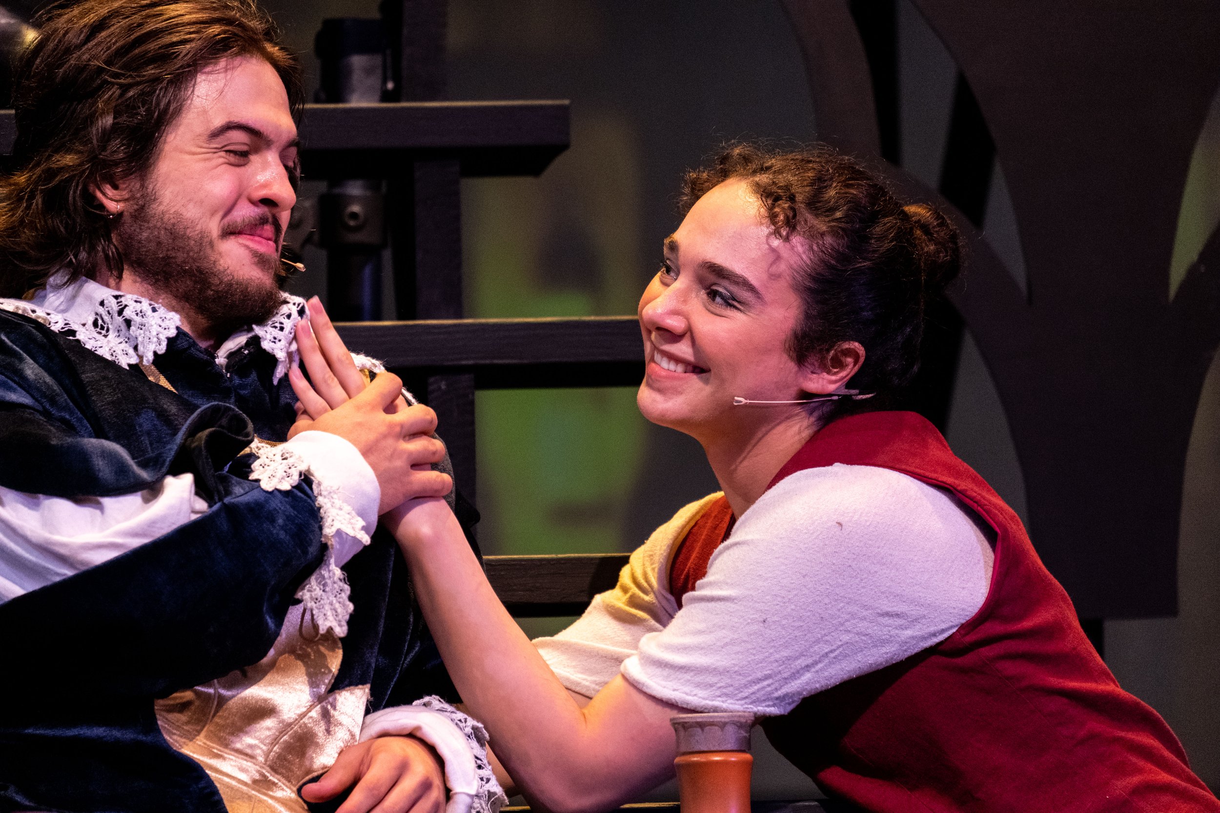  Keelin Jayne (L) as Aramis smiles at Saba Asgair (R) as Sabine as her character becomes drunkenly enamored with him on stage at the Santa Monica College Theater Department Main Stage on the Main Campus in Santa Monica, Calif. during the opening week