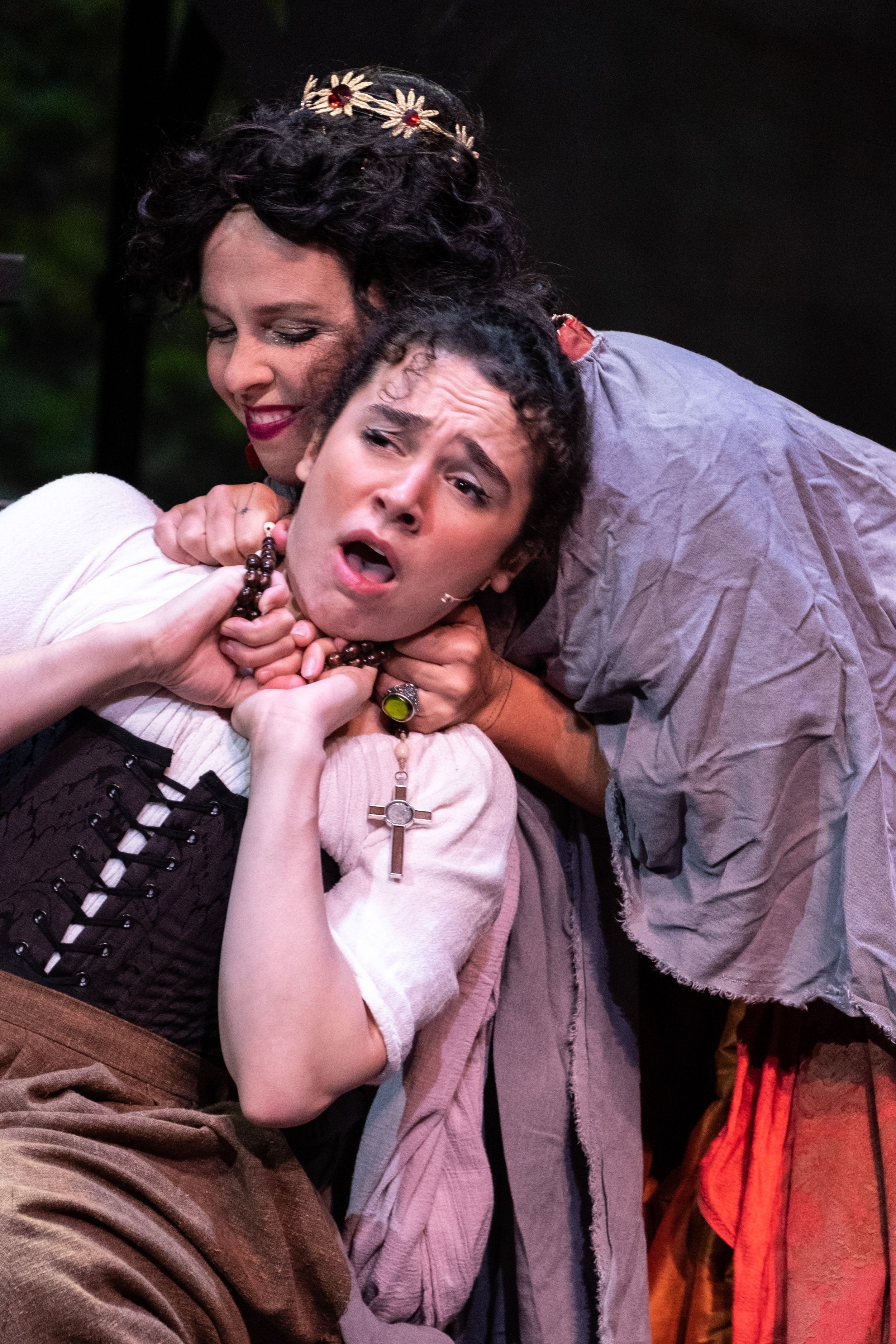  Megan Winberg as Milady de Winter attempts to strangle Saba Asgari, playing Sabine, on stage at the Santa Monica College Theater Department Main Stage on the Main Campus in Santa Monica, Calif. during the opening weekend of Ken Ludwig's The Three Mu