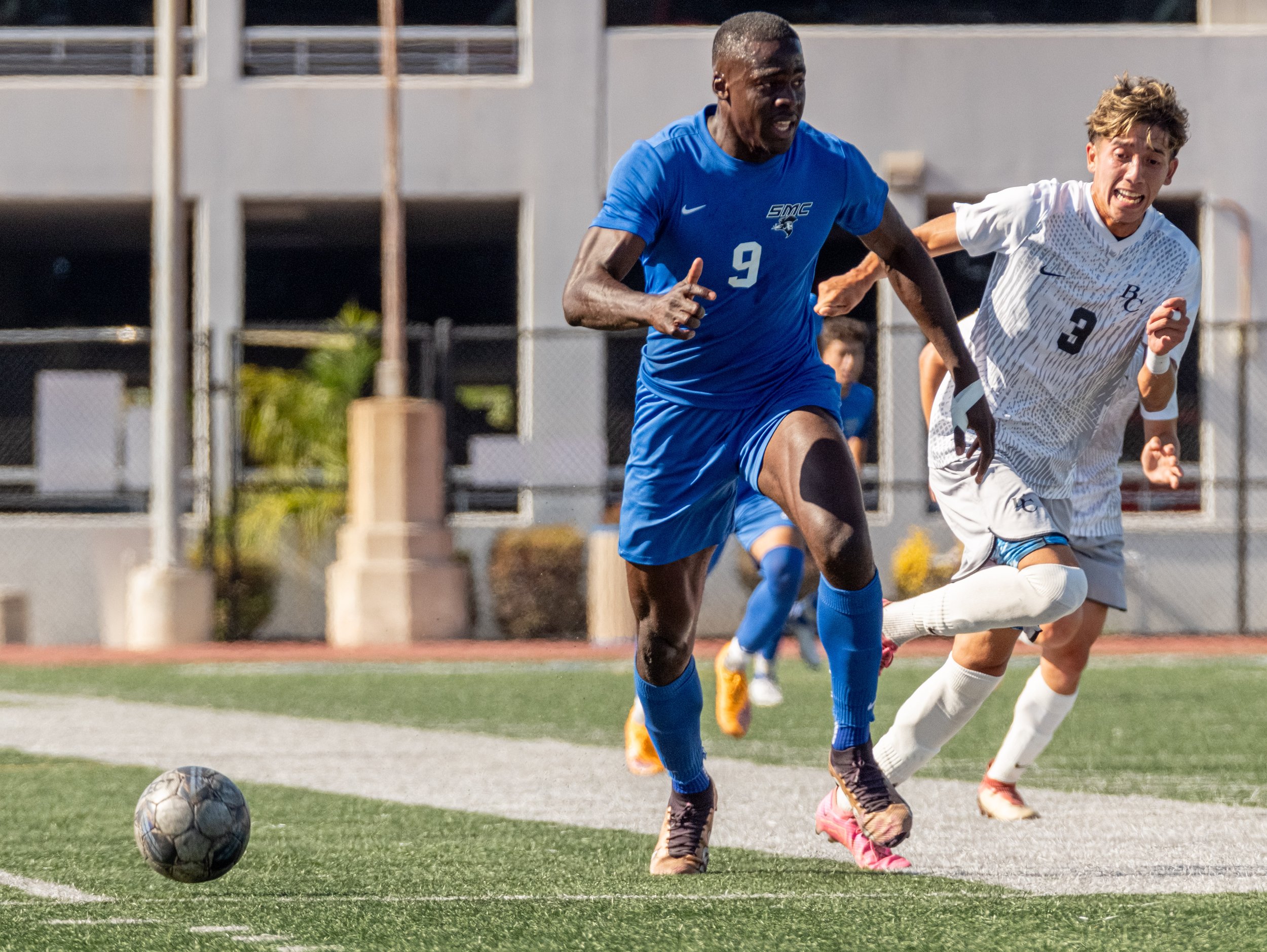  Santa Monica College(SMC) men's soccer forward Philip Hephzibah(3) running towards the ball while his jersey is being pulled by Bakersfield Renegade defender Elijah Espinoza(3) on Tues, Oct. 3. SMC would go and shutout the Renegades with a score of 