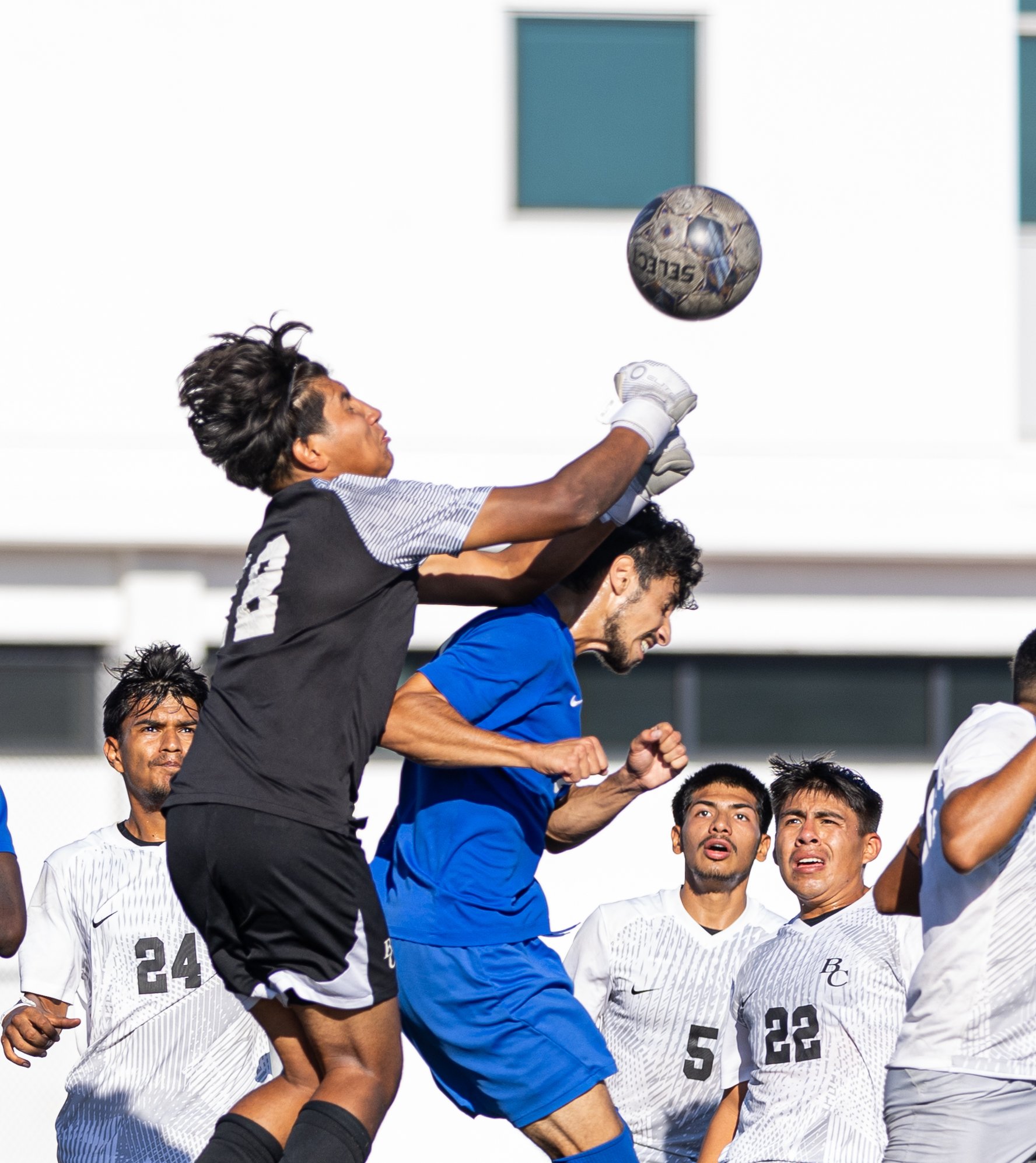  Bakersfield Renegade goalie Hairo Rodriguez(L) punching the ball away from Santa Monica College(SMC) men's soccer midfielder Roey Kivity(R) on Tues, Oct. 3. SMC would go and shutout the Renegades with a score of 3-0 at Corsair Field in Santa Monica,