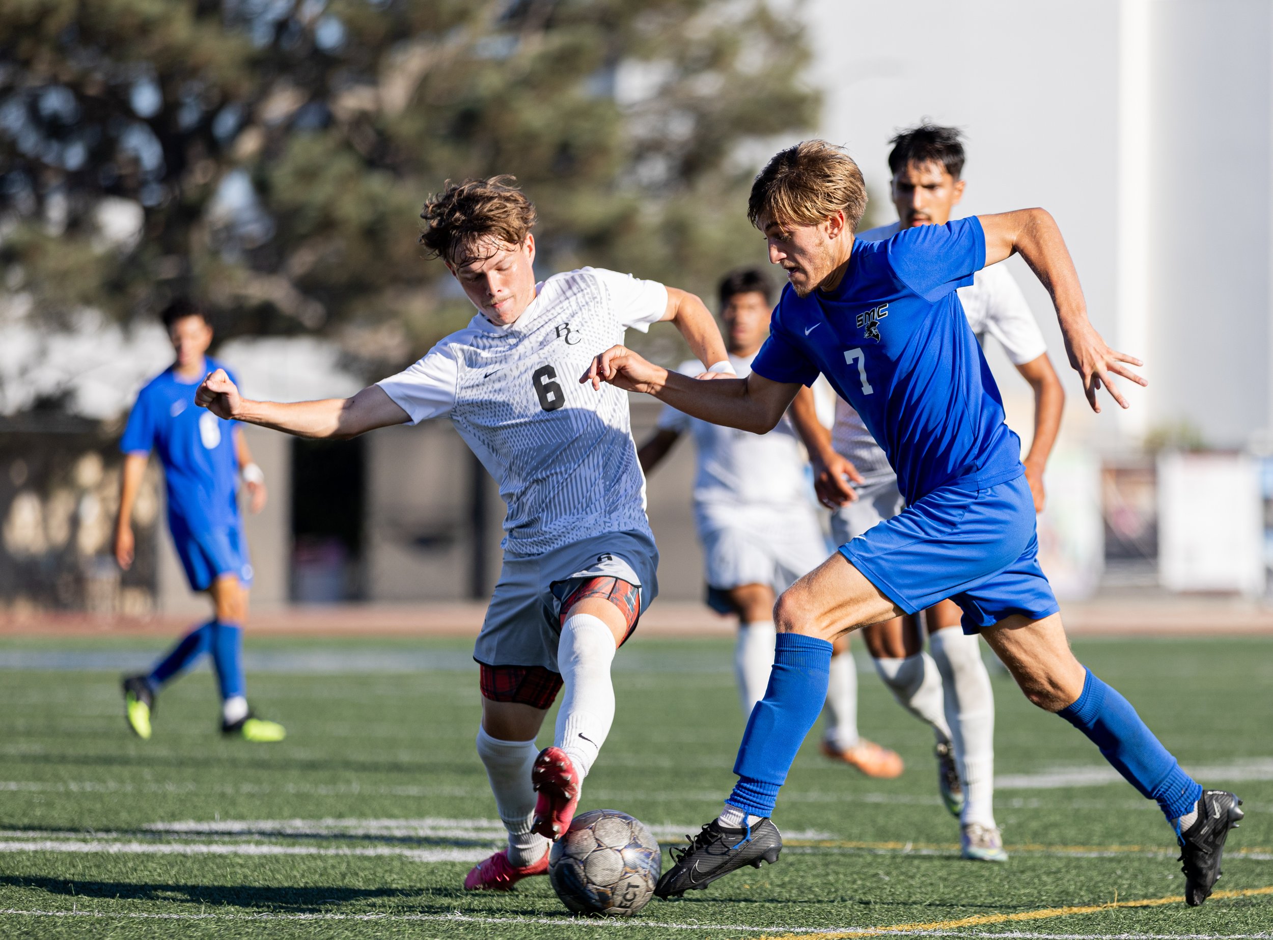  Santa Monica College(SMC) men's soccer forward Darren Lewis(7) being pocketed by Bakersfield Renegade defender Griffin Thompson(6) on Tues, Oct. 3. SMC would go and shutout the Renegades with a score of 3-0 at Corsair Field in Santa Monica, Calif. (
