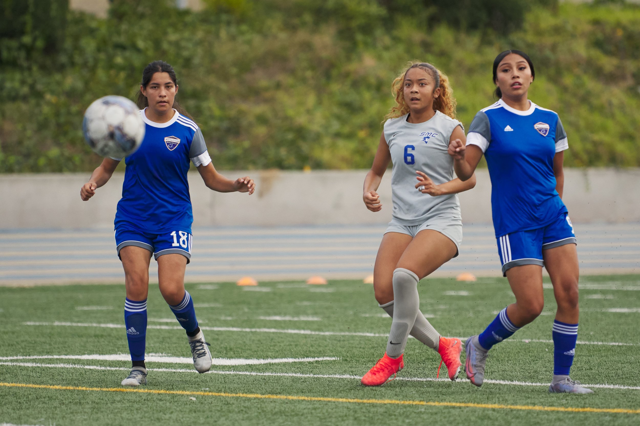  Santa Monica College Corsairs' Tia Lucas (center) and West Los Angeles College Wildcats' Natalie Salas (left) and Ashley Baez all watch Lucas' ball go into the Wildcats' net during the women's soccer match on Friday, Sept. 29, 2023, at Wildcat Stadi