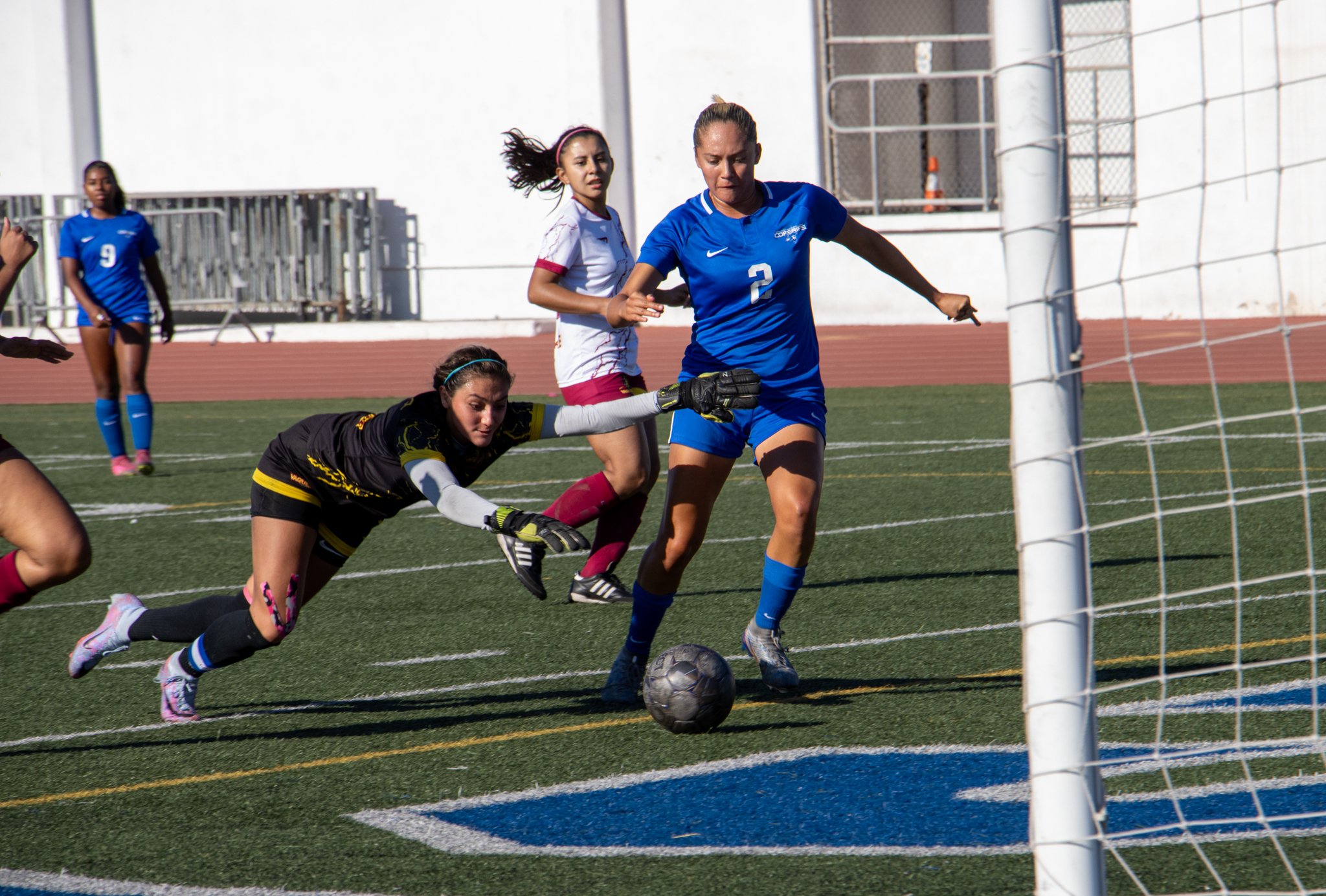  SMC Forward Alanis Rodriguez takes a shot against an open goal as Glendale Goalie Ashley Messier dives in vain after the ball (Bunker King|The Corsair) 
