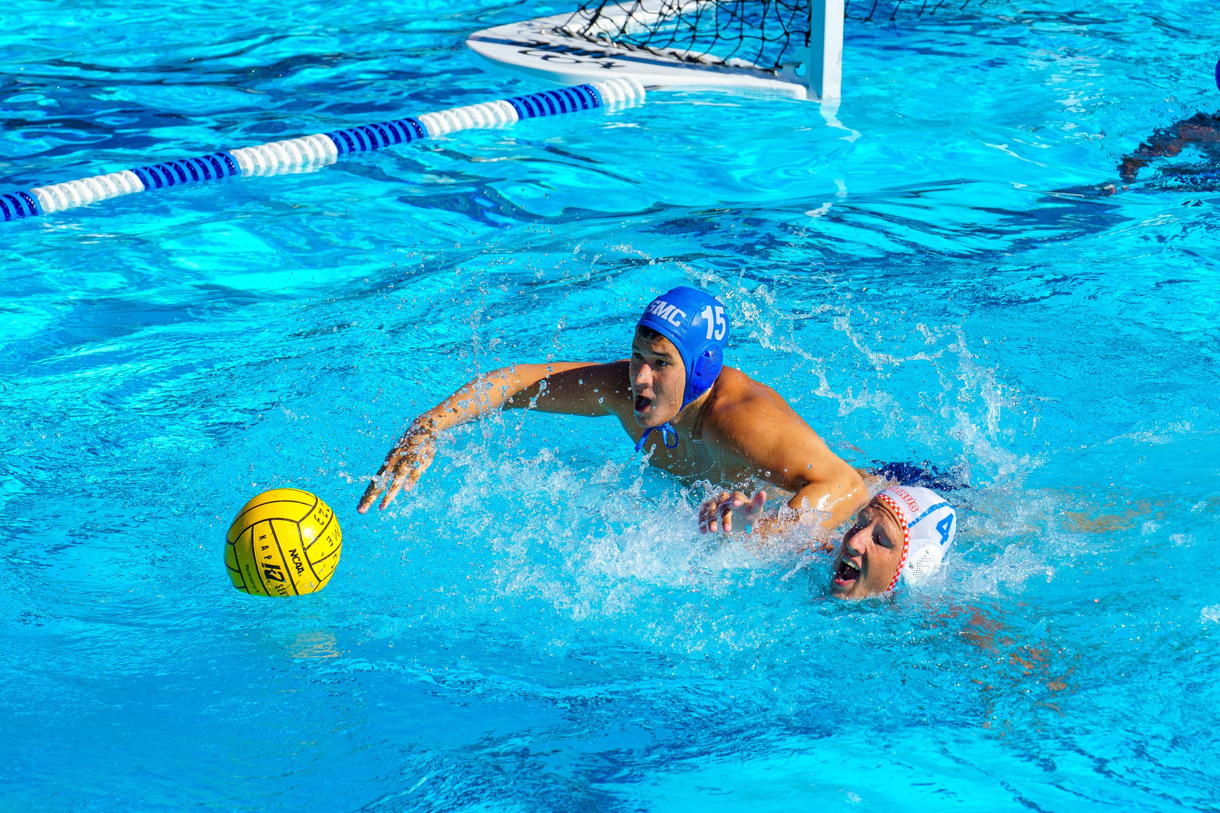  Santa Monica College (SMC) men's water polo utility Ian Zabel (15) leaps to grab the ball against attacker Killian Pressley (4) of the Citrus College Owls, at the SMC water polo conference on Thursday October 5th, 2023 in Santa Monica, Calif. The fi