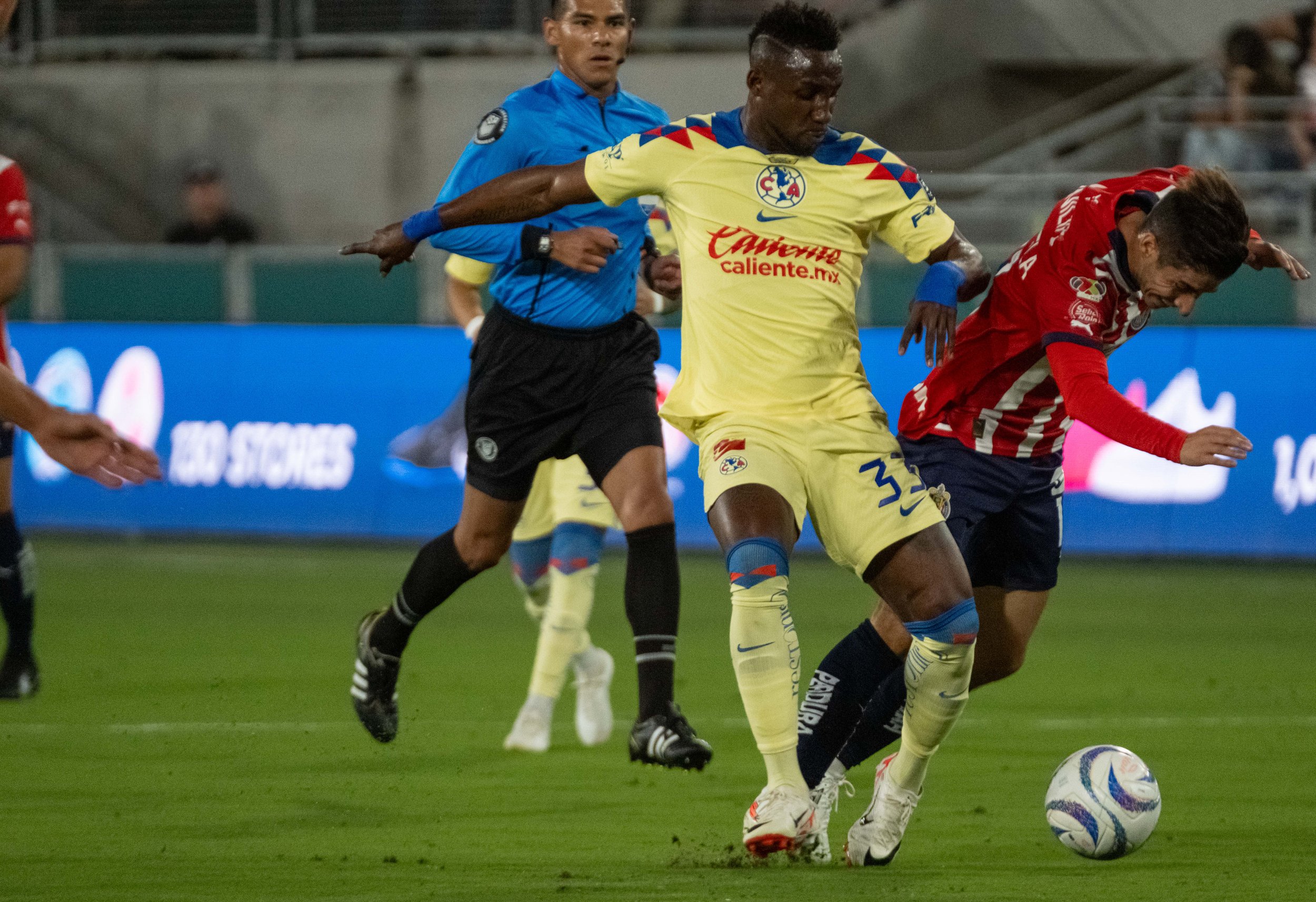  Club America centre-forward Julian Quinones(L) fouling right winger Isaac Brizuela(R) at the Rose Bowl in Pasadena, Calif. on Sunday, Oct. 15. (Danilo Perez | The Corsair) 