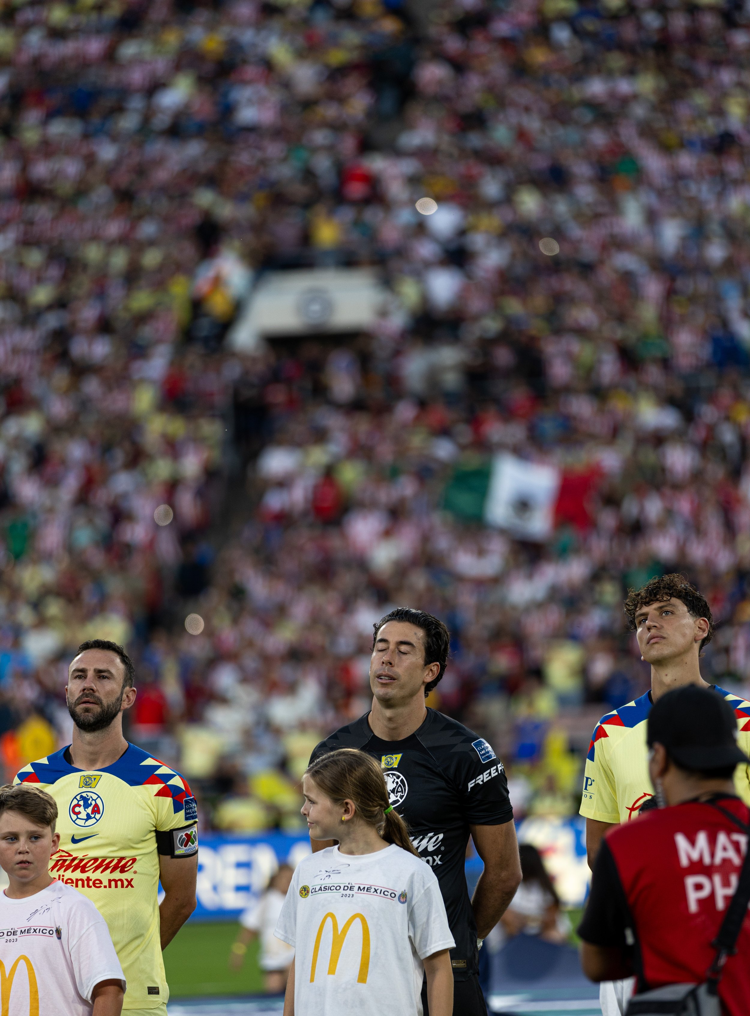  Club America captain Miguel Layun, goalie Oscar Jimenez and Igor Lichnovsky(L-R) singing along with the Mexican national anthem before the start of El Clasico in the Rose Bowl at Pasadena, Calif. on Sunday, Oct. 15. (Danilo Perez | The Corsair) 