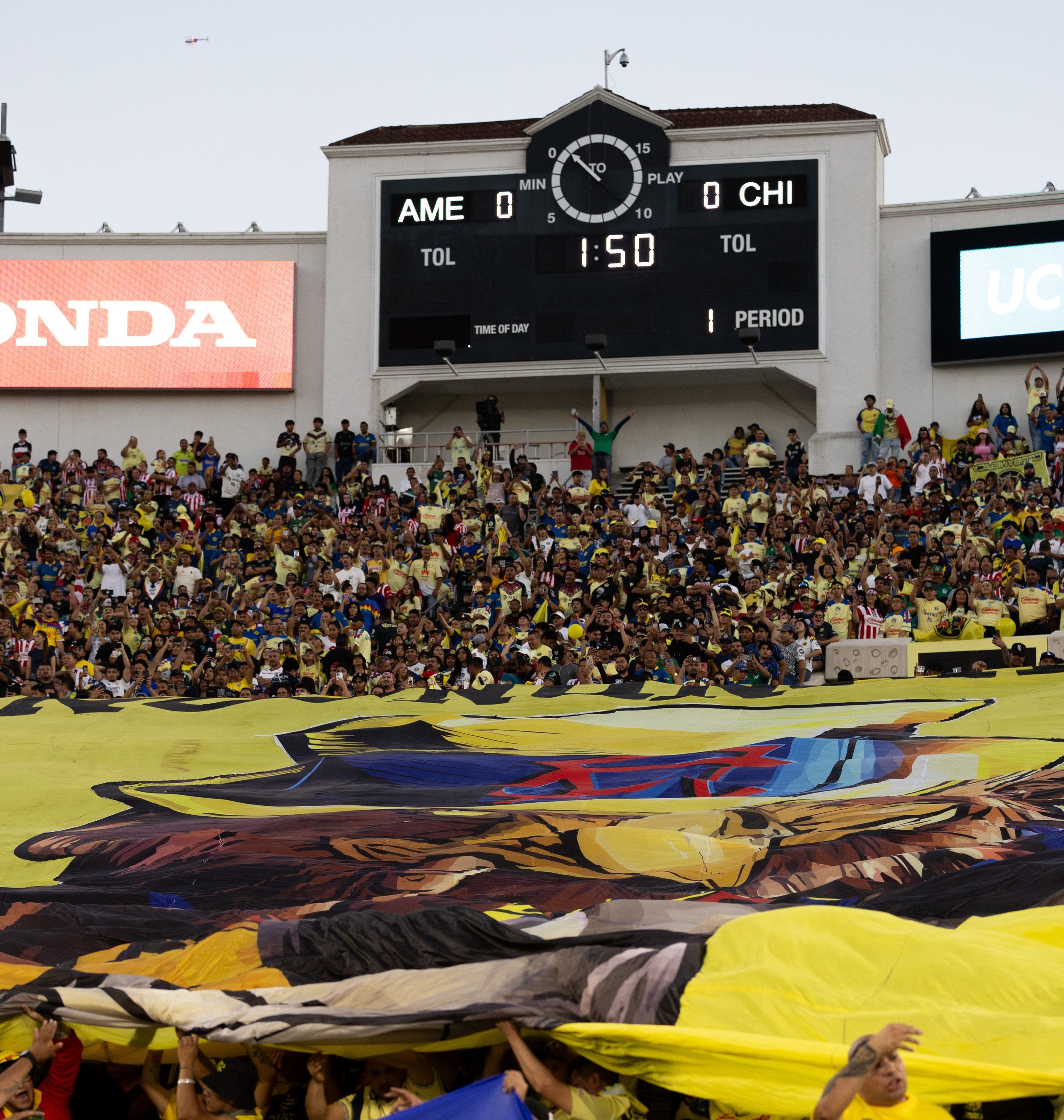  Club America fans holding up a yellow banner with an eagle on it during the match against Chivas at the Rose Bowl in Pasadena, Calif. on Sunday, Oct. 15. (Danilo Perez | The Corsair) 