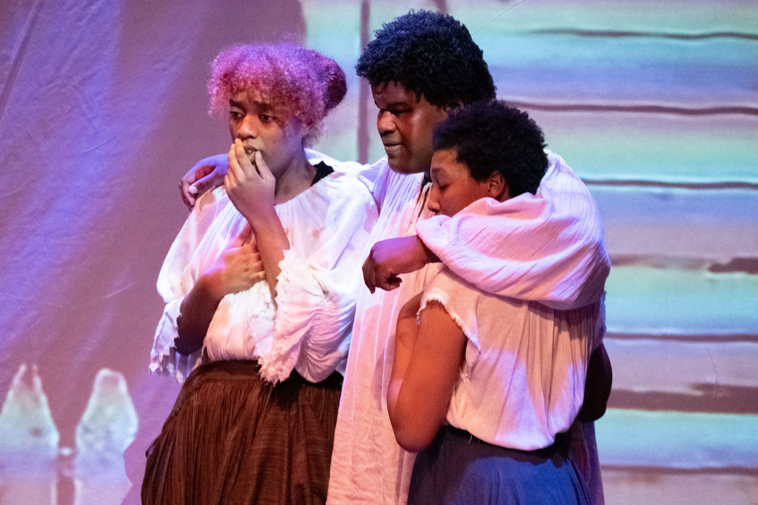  From L to R, Farah Harris, Xcellen Connor and Kyra Surratt react and hold each other as they hear Lucy's story of being whipped during the play "By The River Rivanna," performed on Tuesday Oct. 17th, 2023 in Santa Monica, Calif. at the Santa Monica 