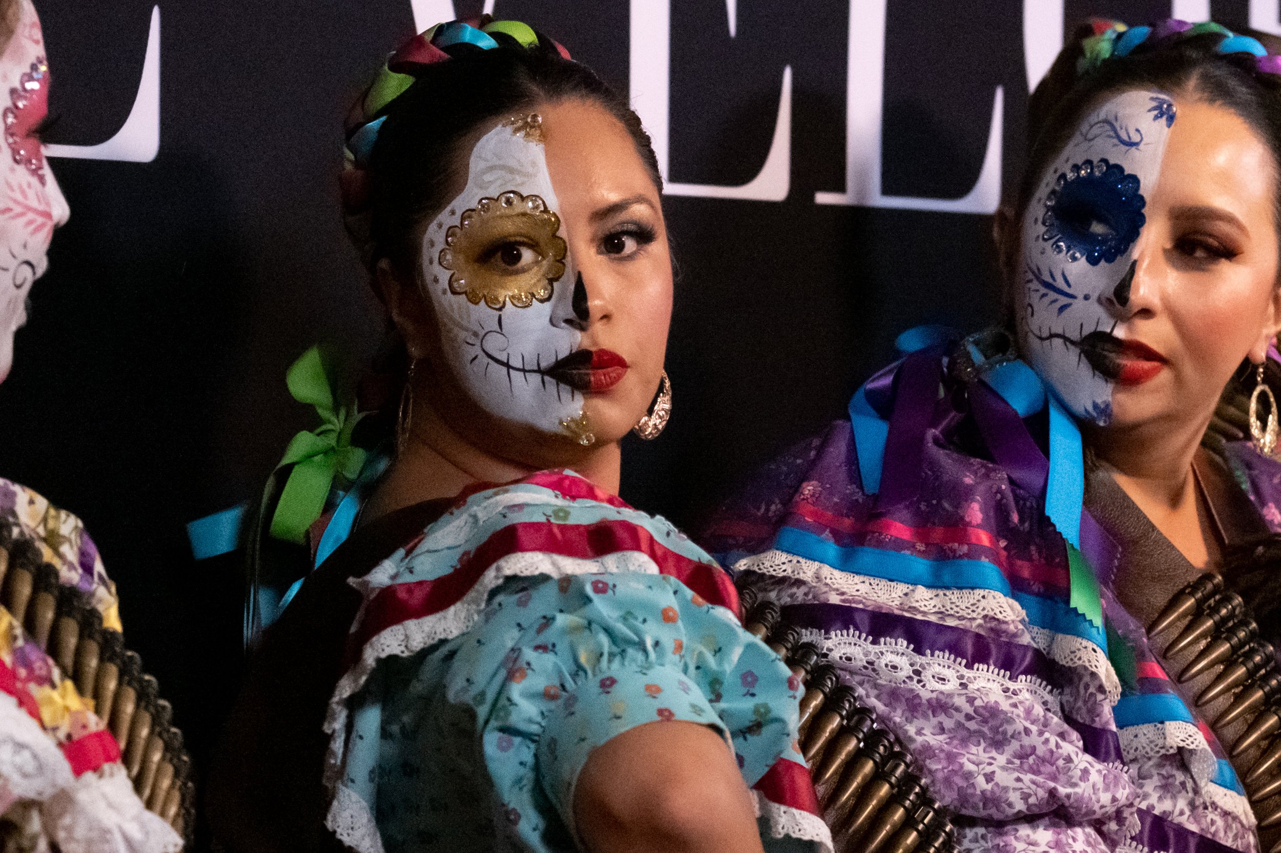  Ballet Folklorico dancers Folklor Pasion Mexicana de Los Angeles pose in front of the step and repeat banner at the entrance to El Velorio's 13th Day of the Dead Music & Arts Festival at La Plaza de la Raza, Los Angeles, Calif. on Saturday Oct. 14, 