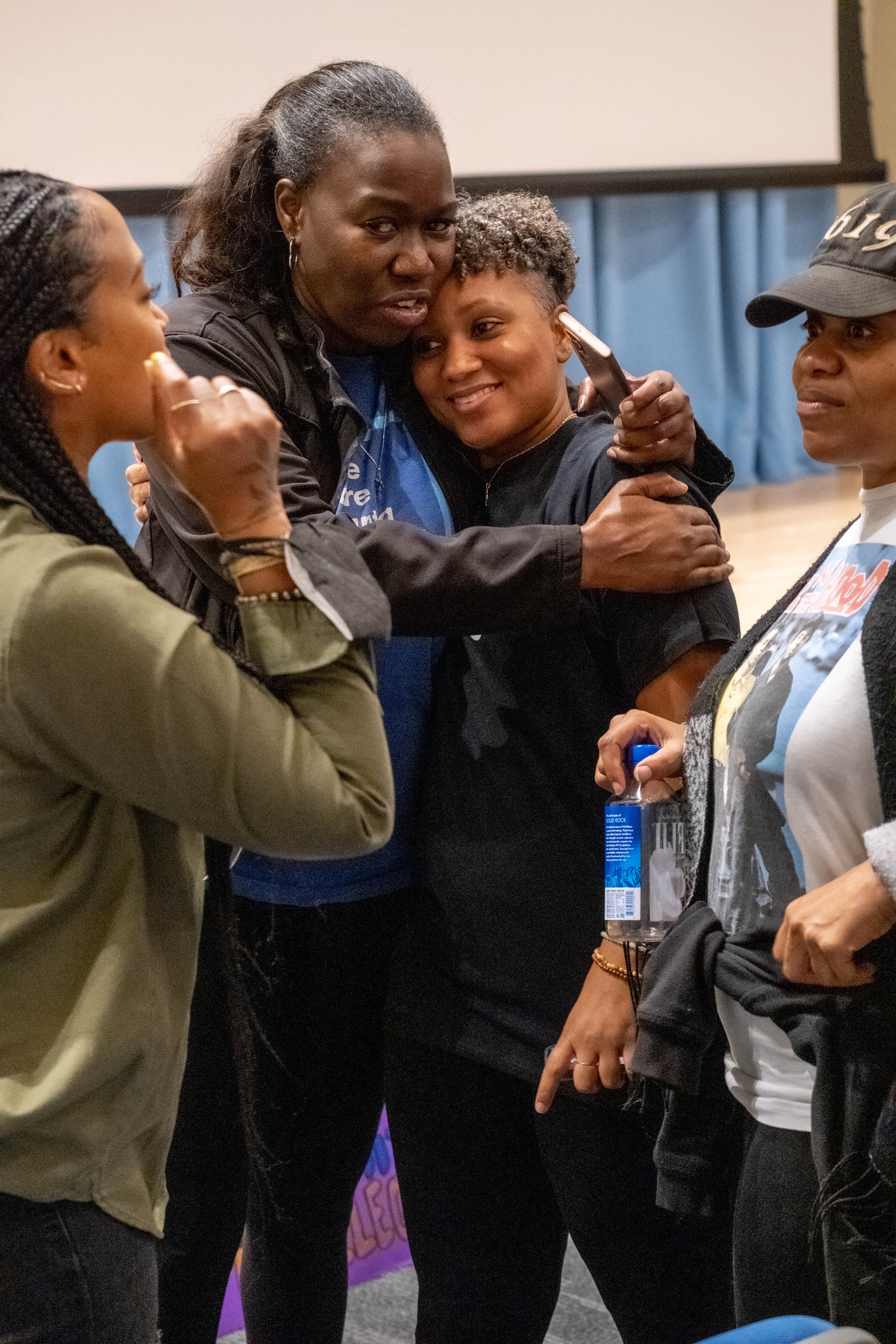  From L to R, Rhea Pitre, Ericka Lesley, Jocelyn Wynn, and Nicole Woodard in conversation and community at the community gathering in lieu of a protest against the play "By The River Rivanna" in the Student Services Orientation Hall on the main campu