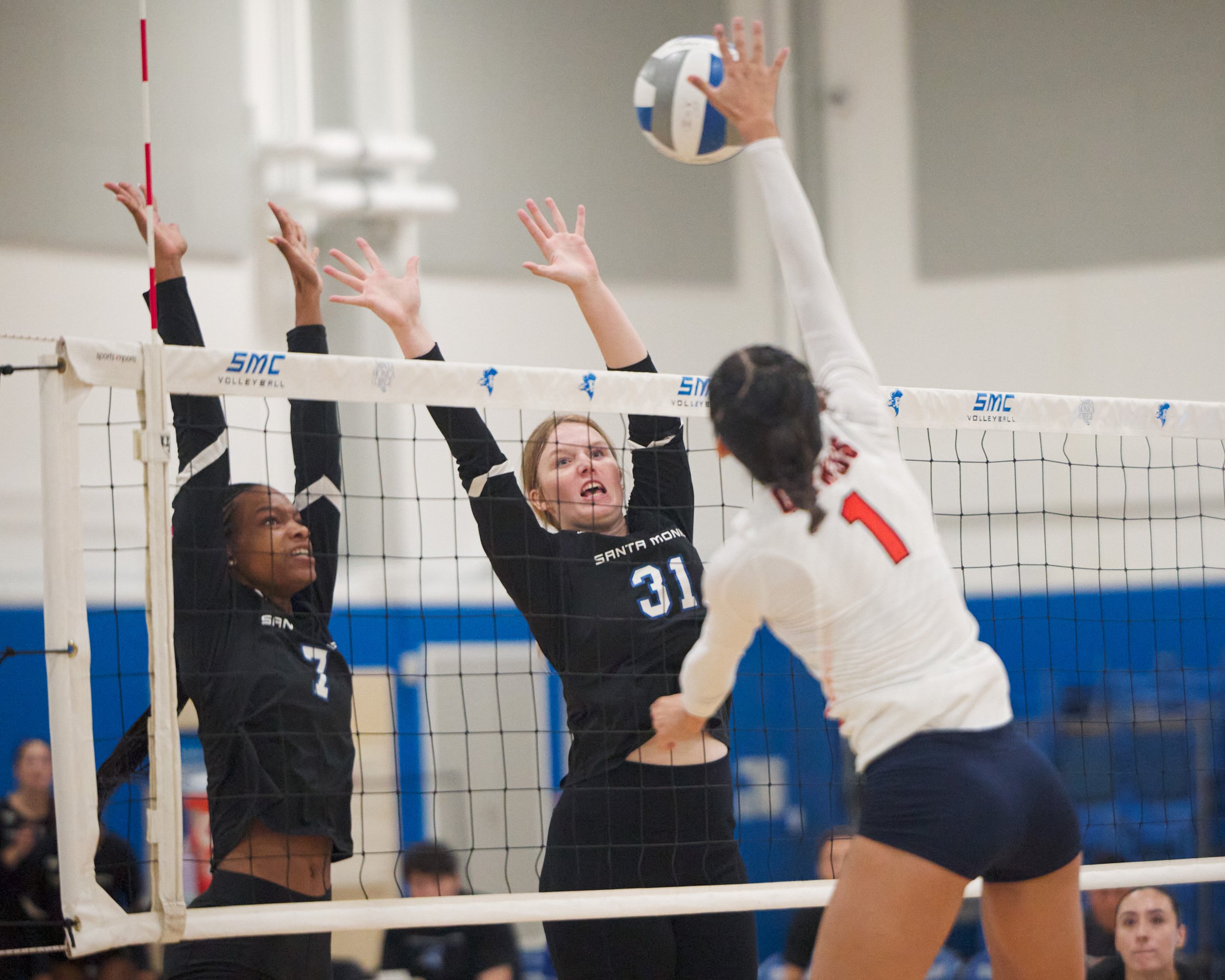  Santa Monica College Corsairs' Zarha Stanton and Mylah Niksa jumpto block the ball from Citrus College Owls' Faith Evaro during the women's volleyball match on Wednesday, Oct. 25, 2026, at Corsair Gym in Santa Monica, Calif. The Corsairs won 3-0. (N