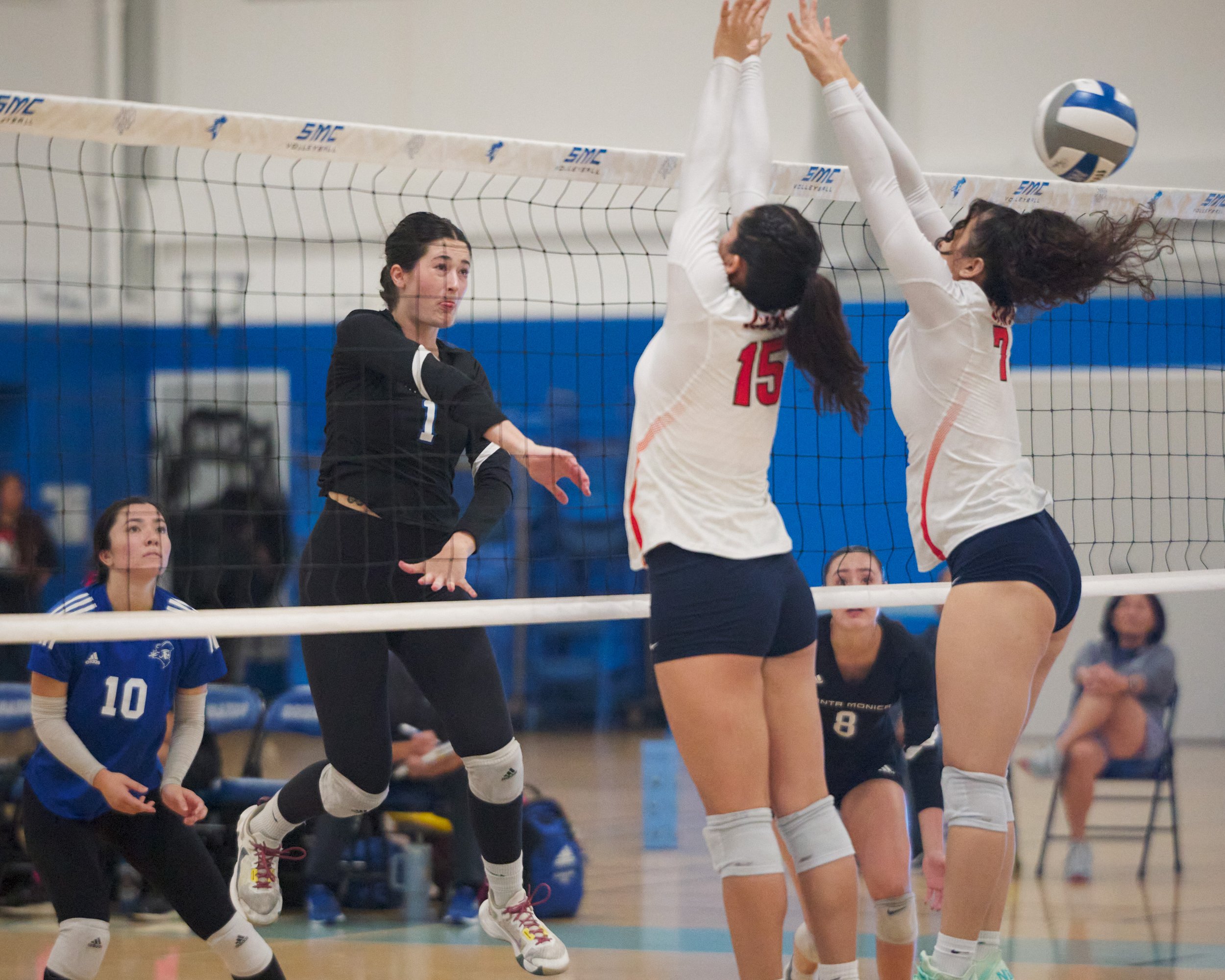  Santa Monica College Corsairs' Maiella Riva hits the ball past Citrus College Owls' Desiree Reyes and Tara Biscan during the women's volleyball match on Wednesday, Oct. 25, 2026, at Corsair Gym in Santa Monica, Calif. The Corsairs won 3-0. (Nicholas