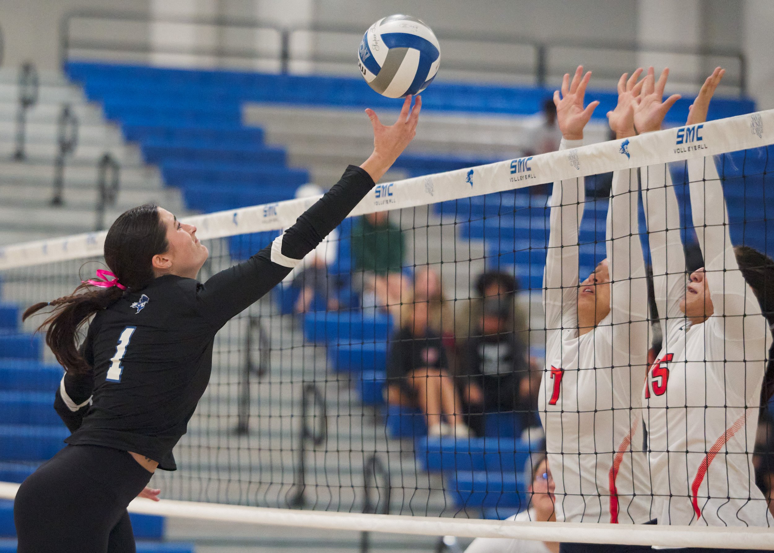  Santa Monica College Corsairs' Maiella Riva sends the ball past Citrus College Owls' Tara Biscan and Desiree Reyes during the women's volleyball match on Wednesday, Oct. 25, 2026, at Corsair Gym in Santa Monica, Calif. The Corsairs won 3-0. (Nichola