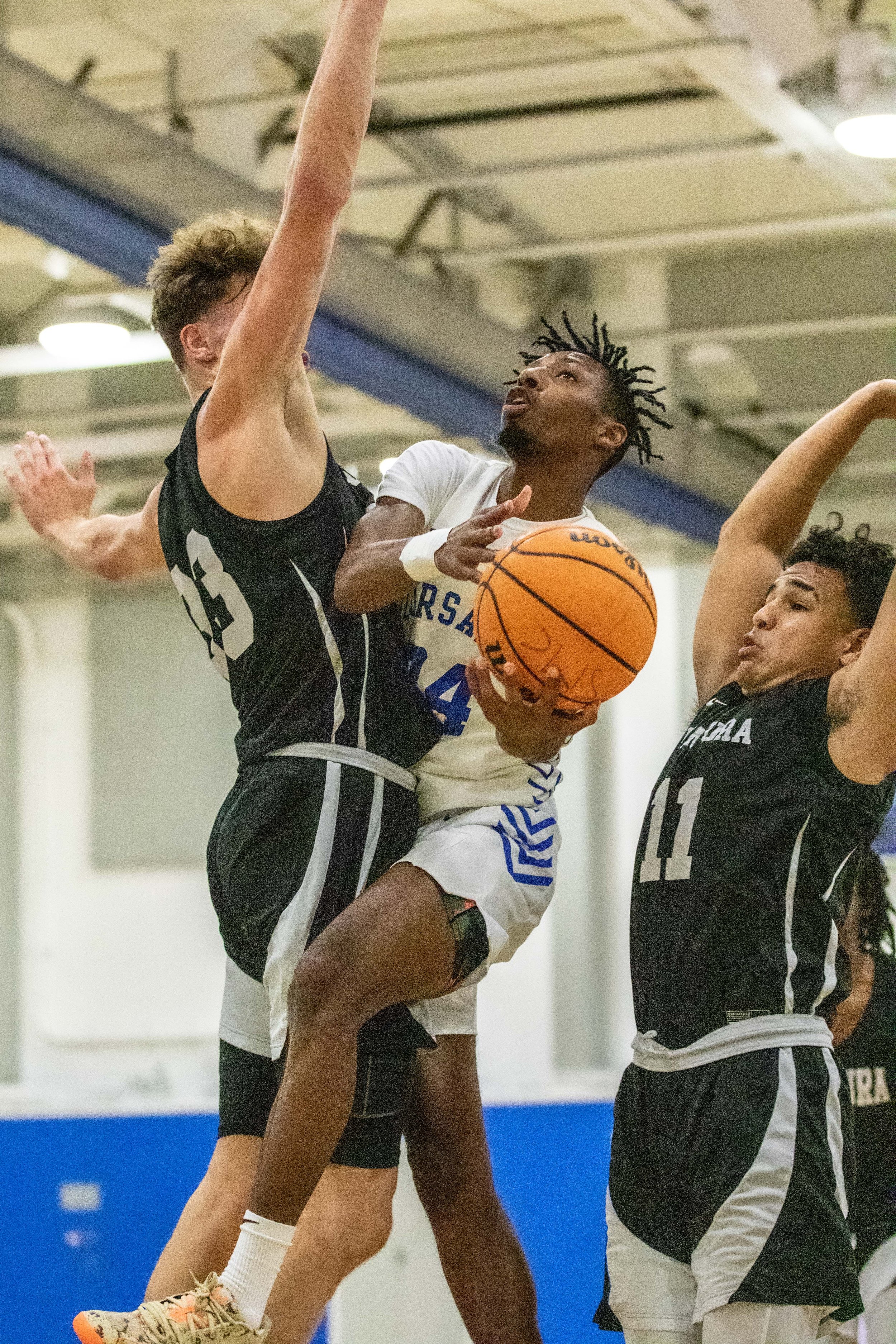  Santa Monica Corsairs' small forward Malachi Wright (24) with Ventura Pirates Stacy Johnson (23) and Carter Alexander (11) on Thursday, Oct. 26, 2023 at the Corsair Gym in Santa Monica, Calif. during the men's basketball game against the Ventura Pir